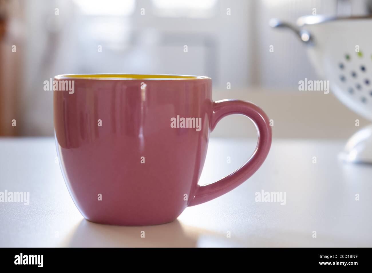 Download Coffee Cup Mockup On A Kitchen Table Pink Color Blank Mug With Handle For Hot Beverage Blurred Background Advertise Branding Template Stock Photo Alamy