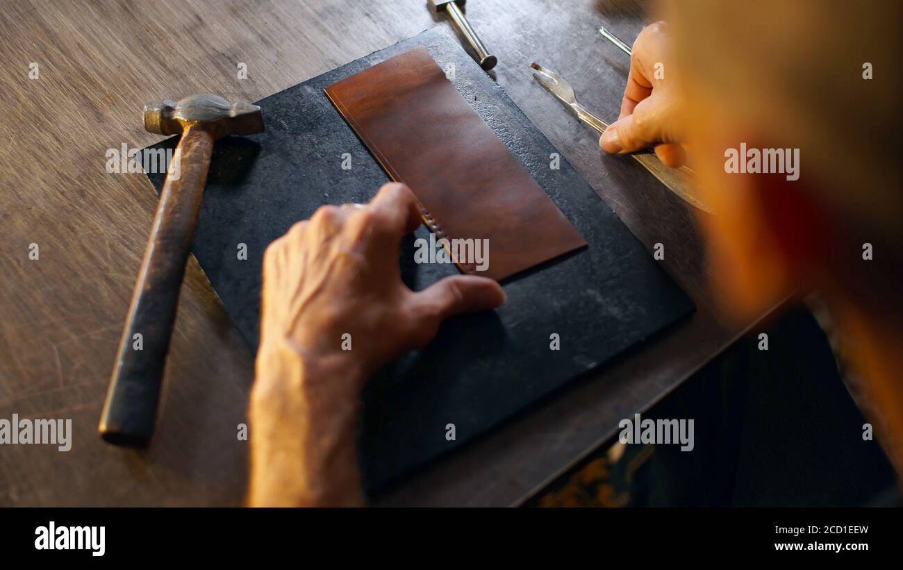 Leather craft tools on cutting mat Stock Photo - Alamy