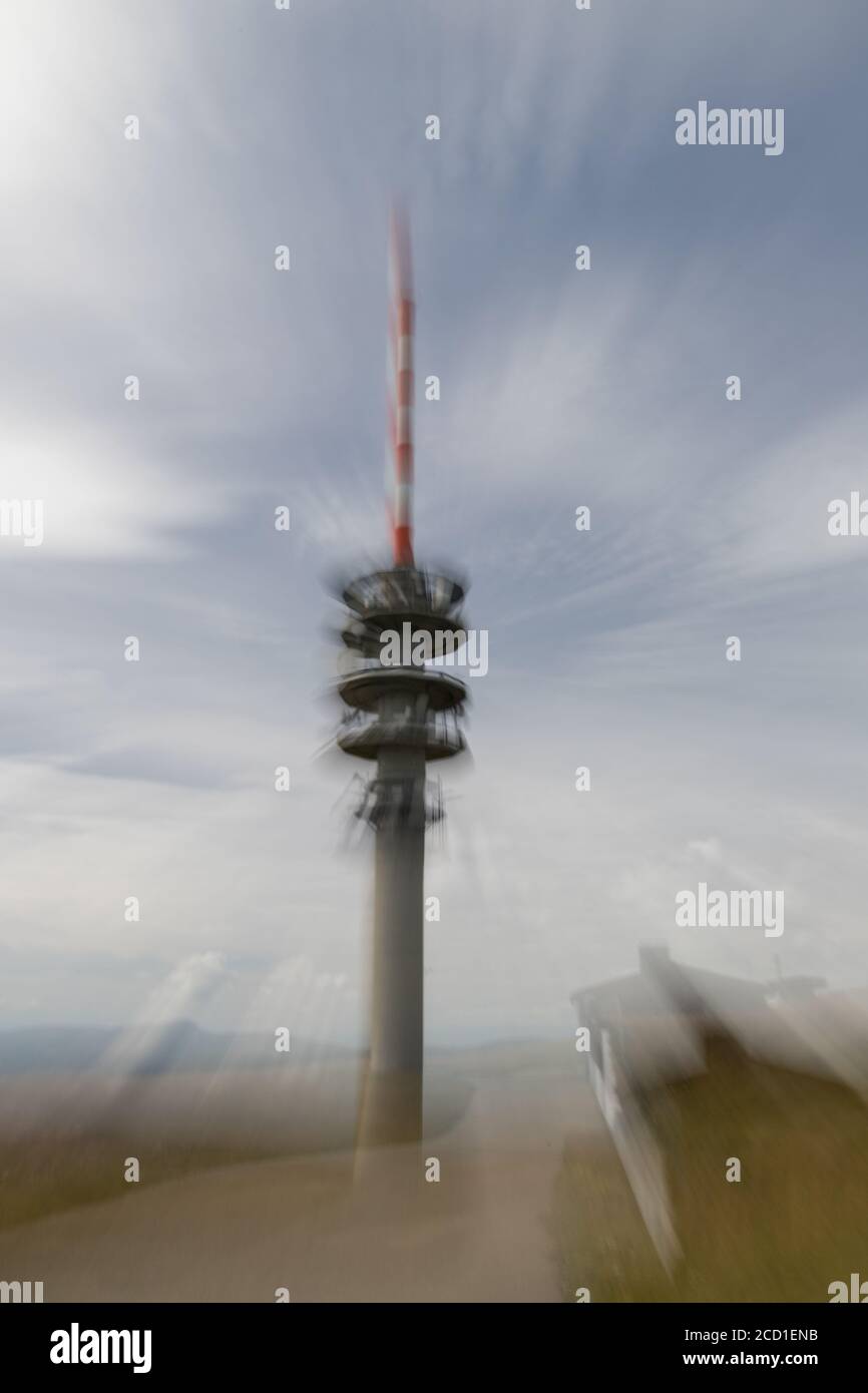 The television tower with zoom effect on the top of the Feldberg in the Black Forest in Germany Stock Photo
