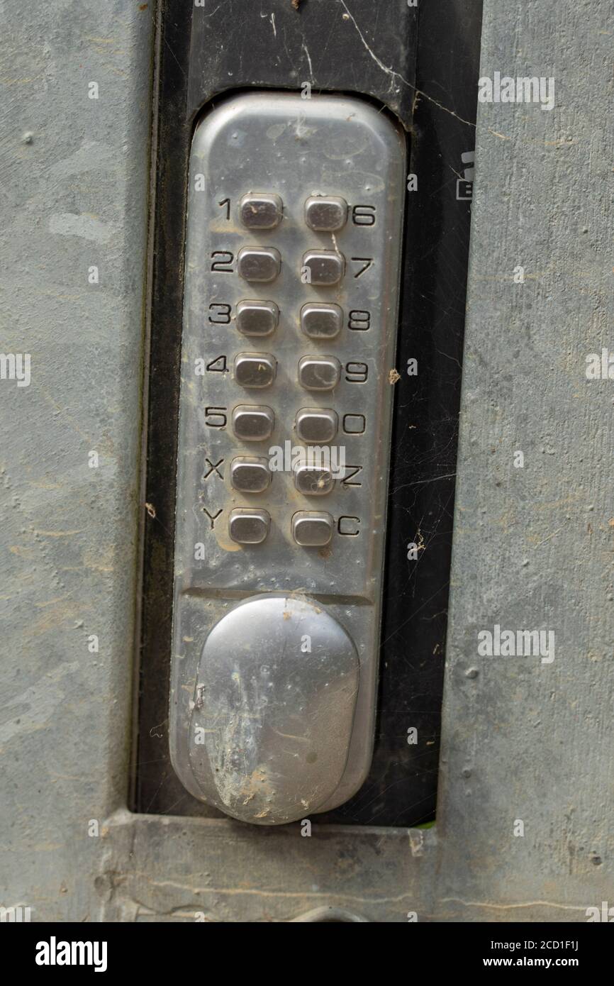 Silver Keypad lock in industrial metal door Stock Photo