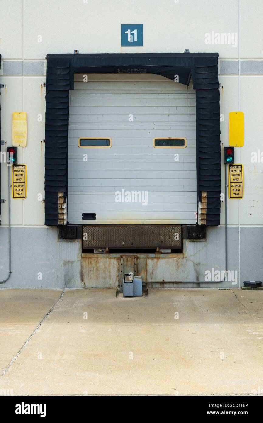 Warehouse loading docks with trucks Stock Photo