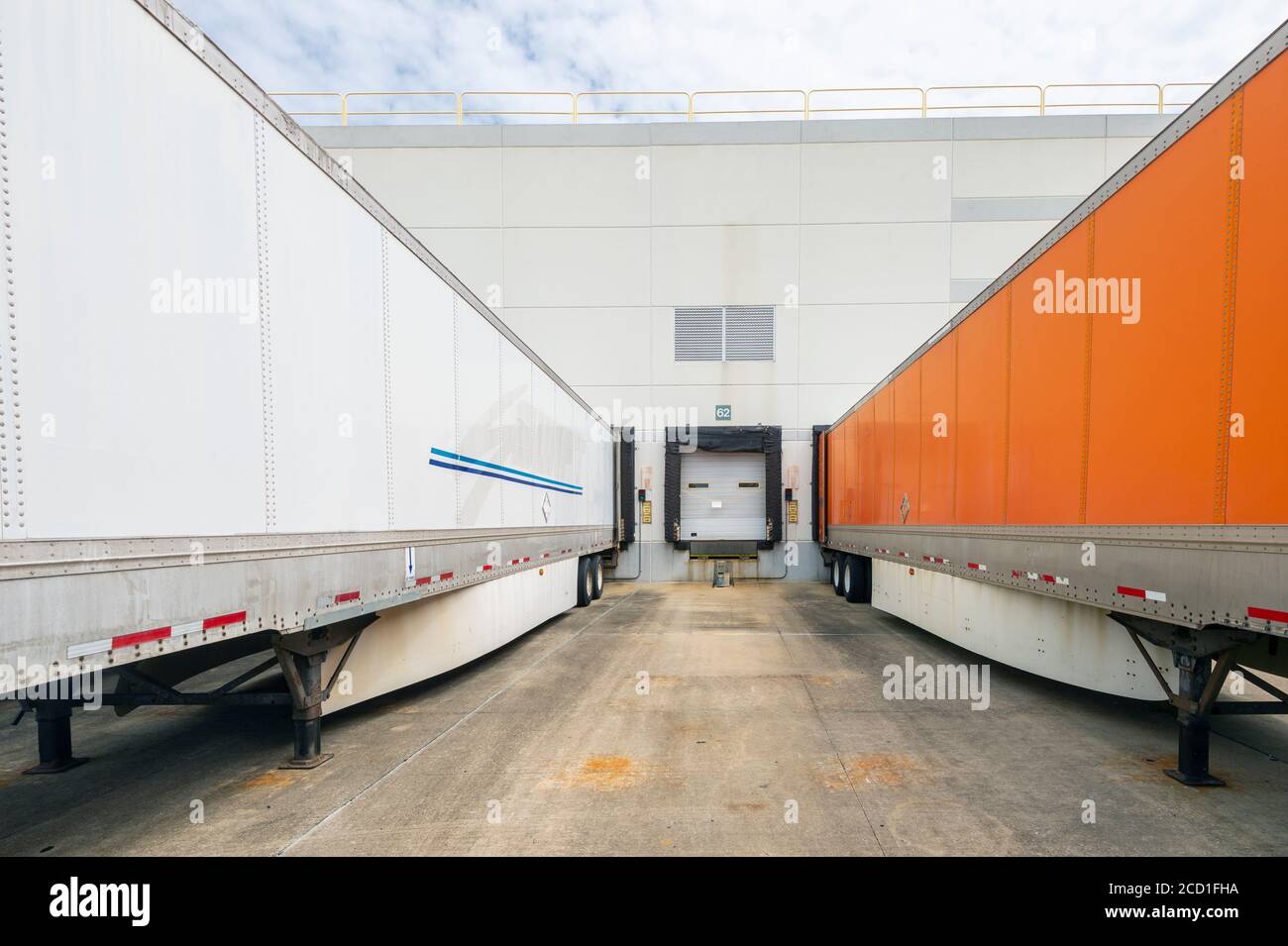 Warehouse loading docks with trucks Stock Photo