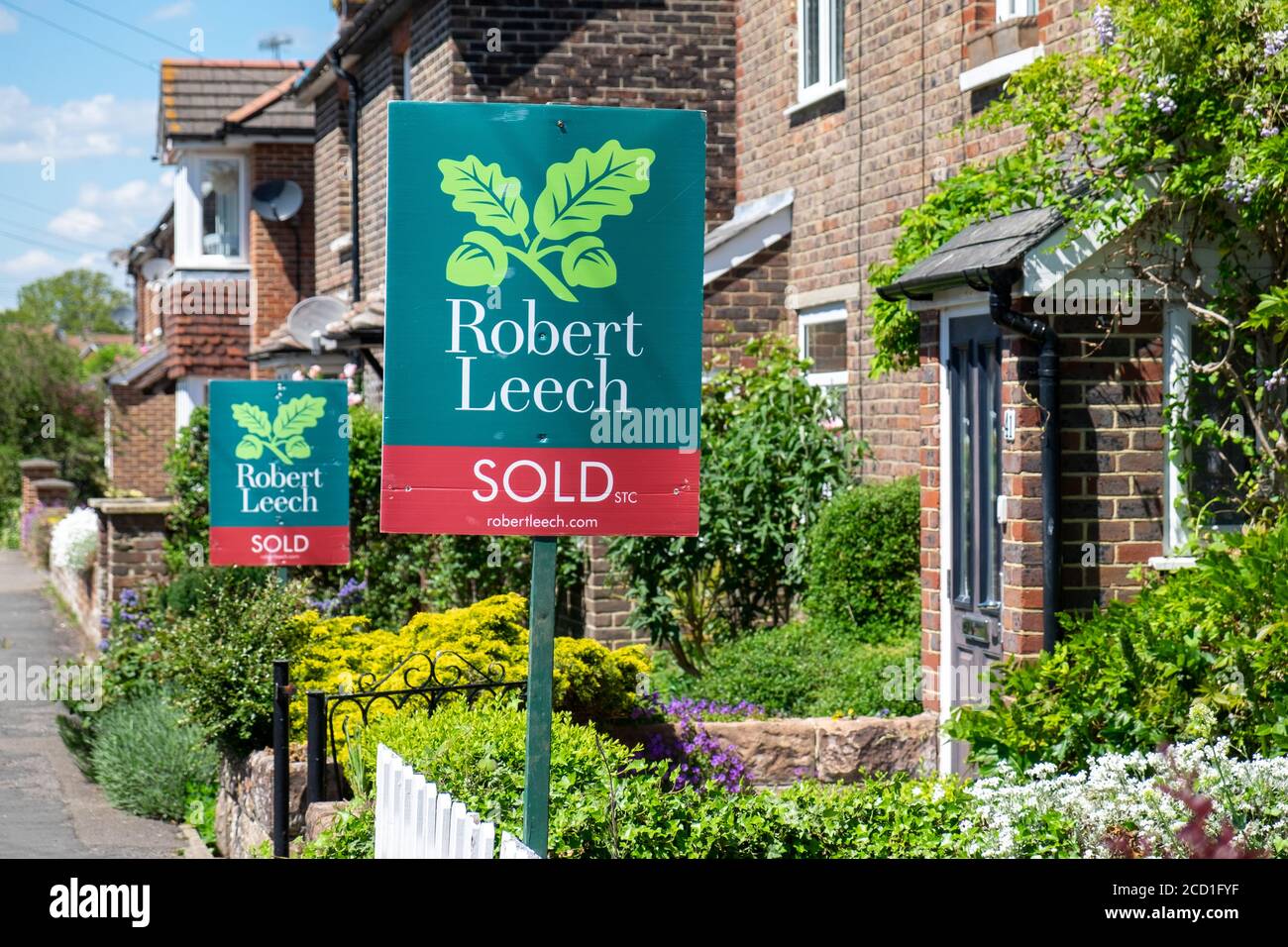 Houses sold signs in Lingfield, Surrey, England, UK Stock Photo Alamy