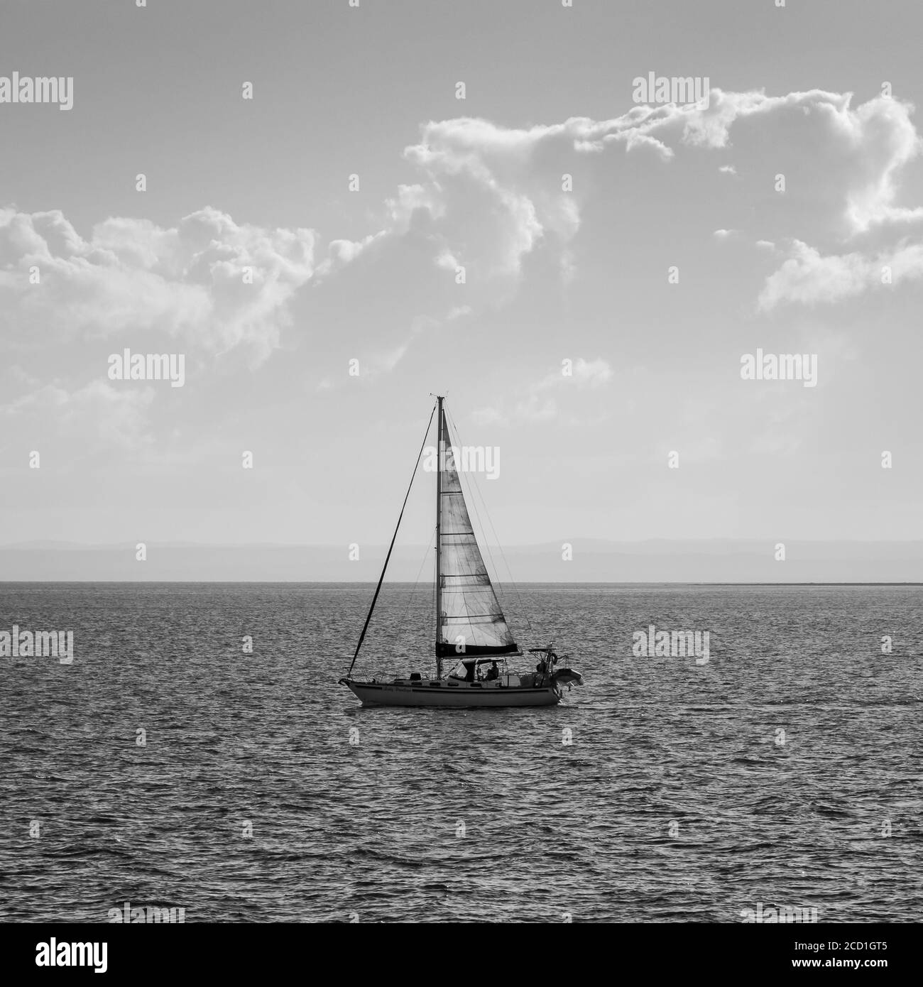 Sailing boat on the ocean in black and white Stock Photo