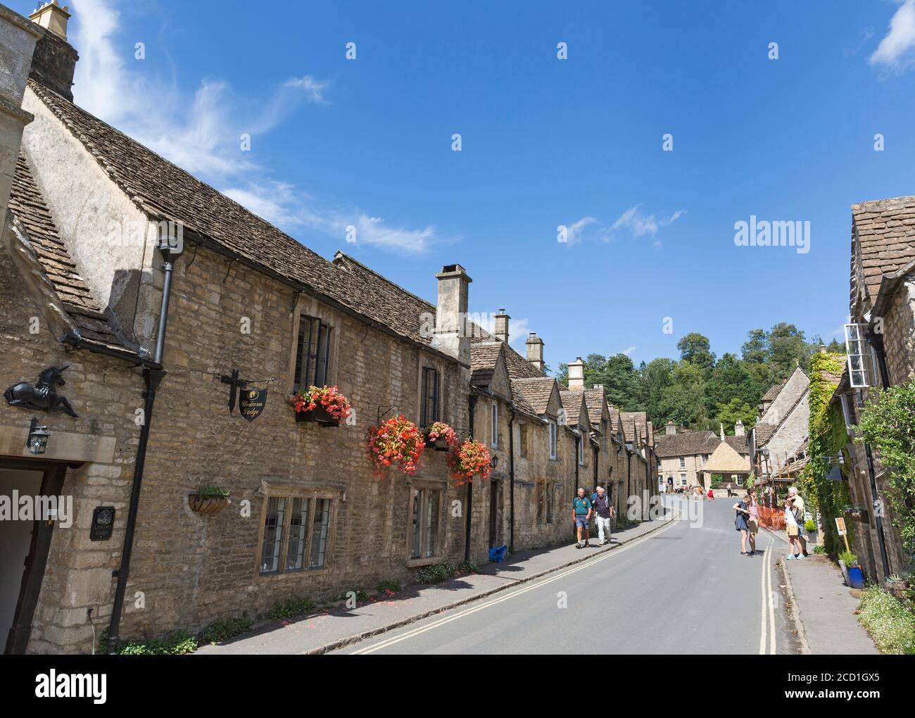 Old stone buildings and village street, “Castle Combe”, Wiltshire ...