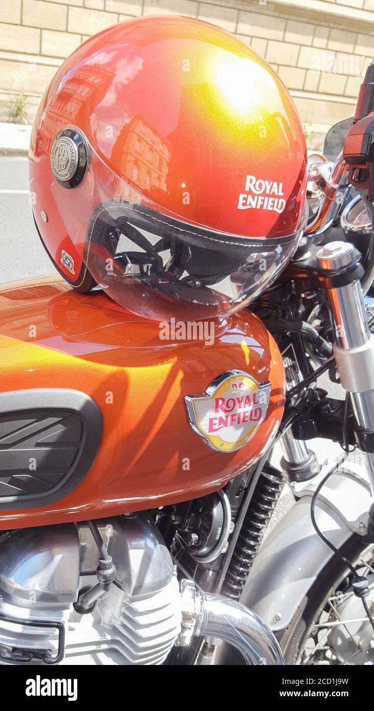 Bordeaux Aquitaine France 08 16 2020 Royal Enfield old school motorcycle orange color with engine motor detail and colorful vintage helmet of Stock Photo Alamy