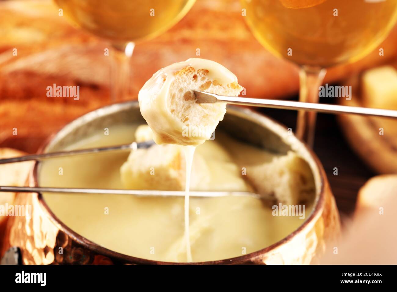 Gourmet Swiss fondue dinner on a winter evening with assorted cheeses