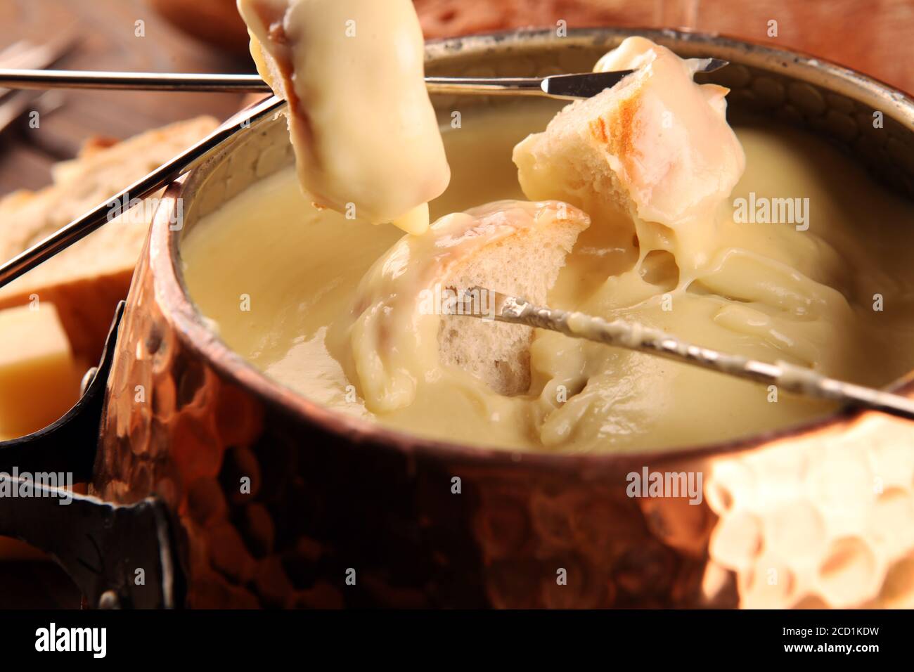 Gourmet Swiss fondue dinner on a winter evening with assorted cheeses