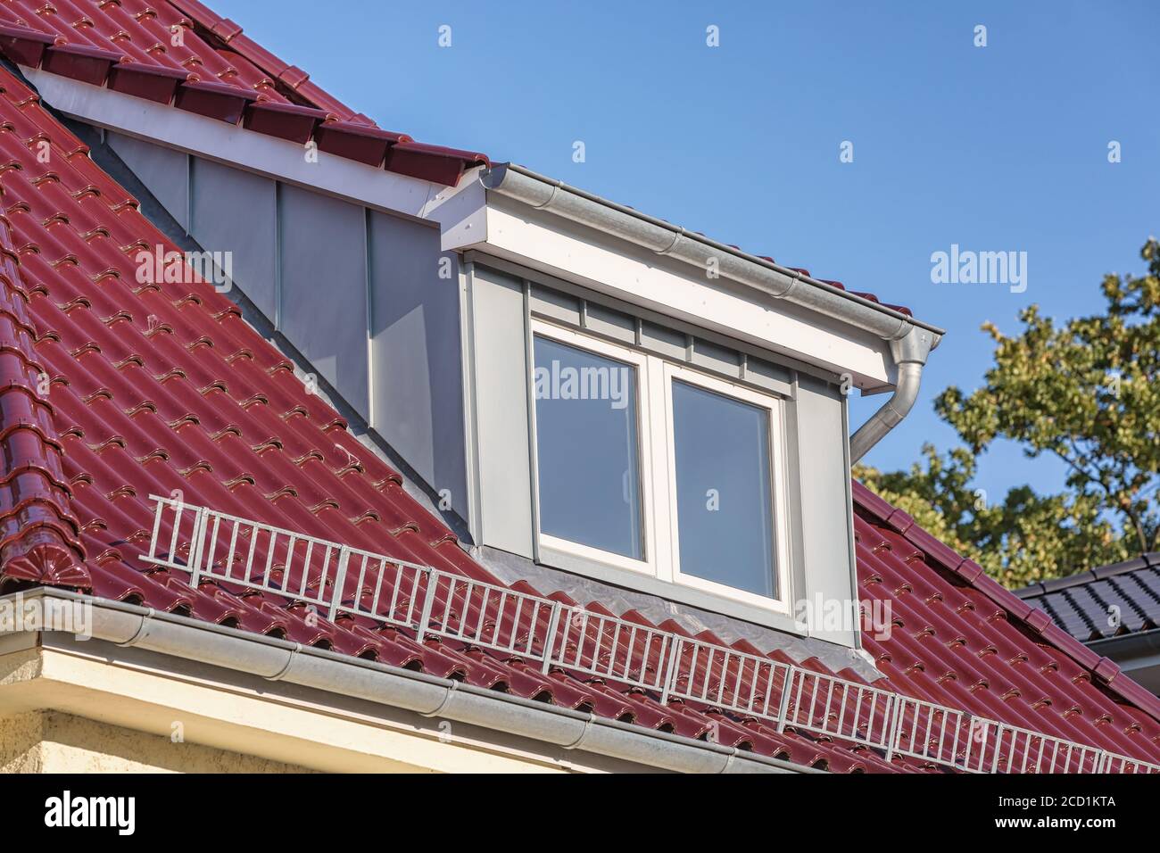 zinc dormer on red roof Stock Photo