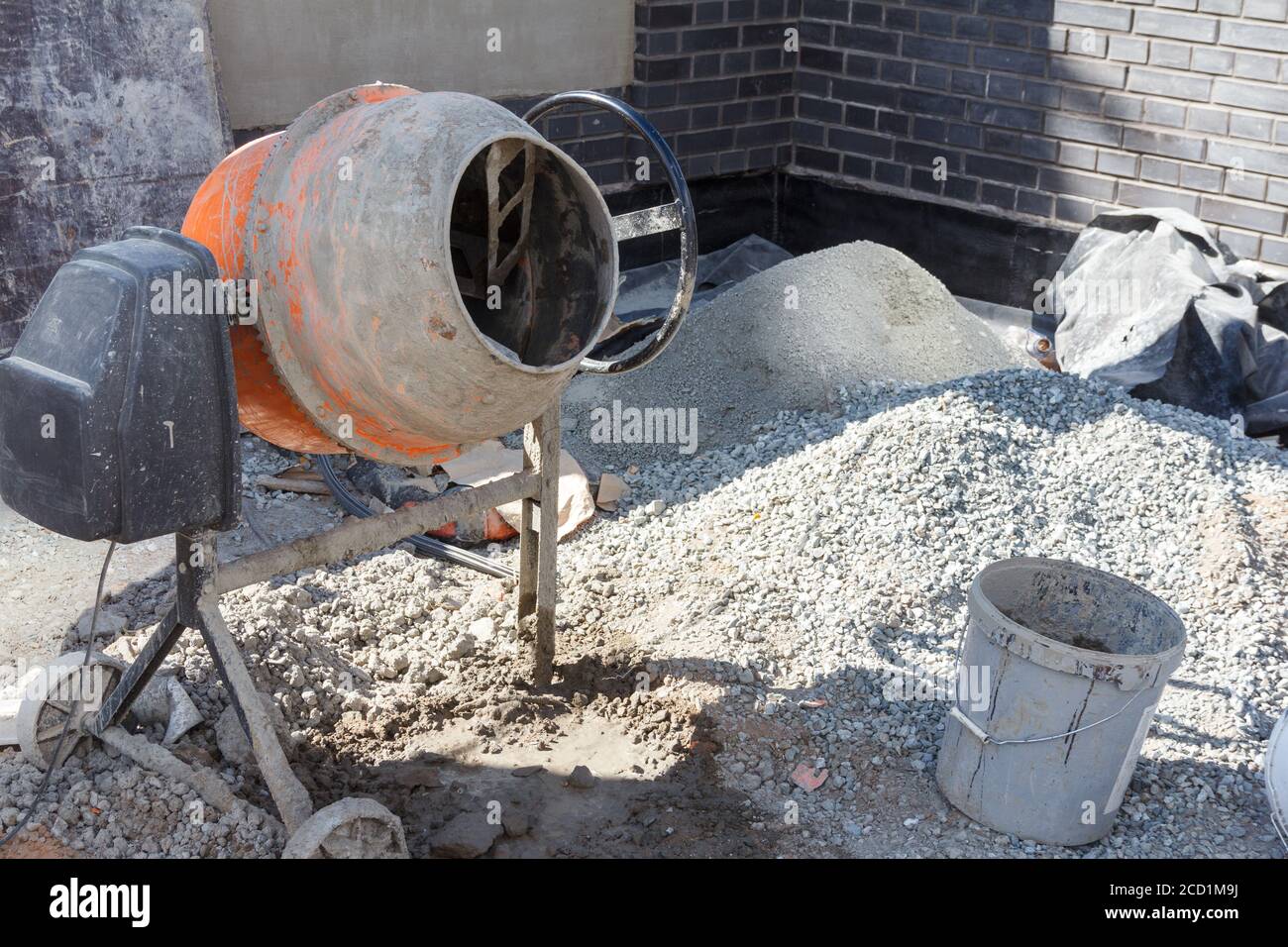 Concrete mixer at a construction site. Construction equipment for