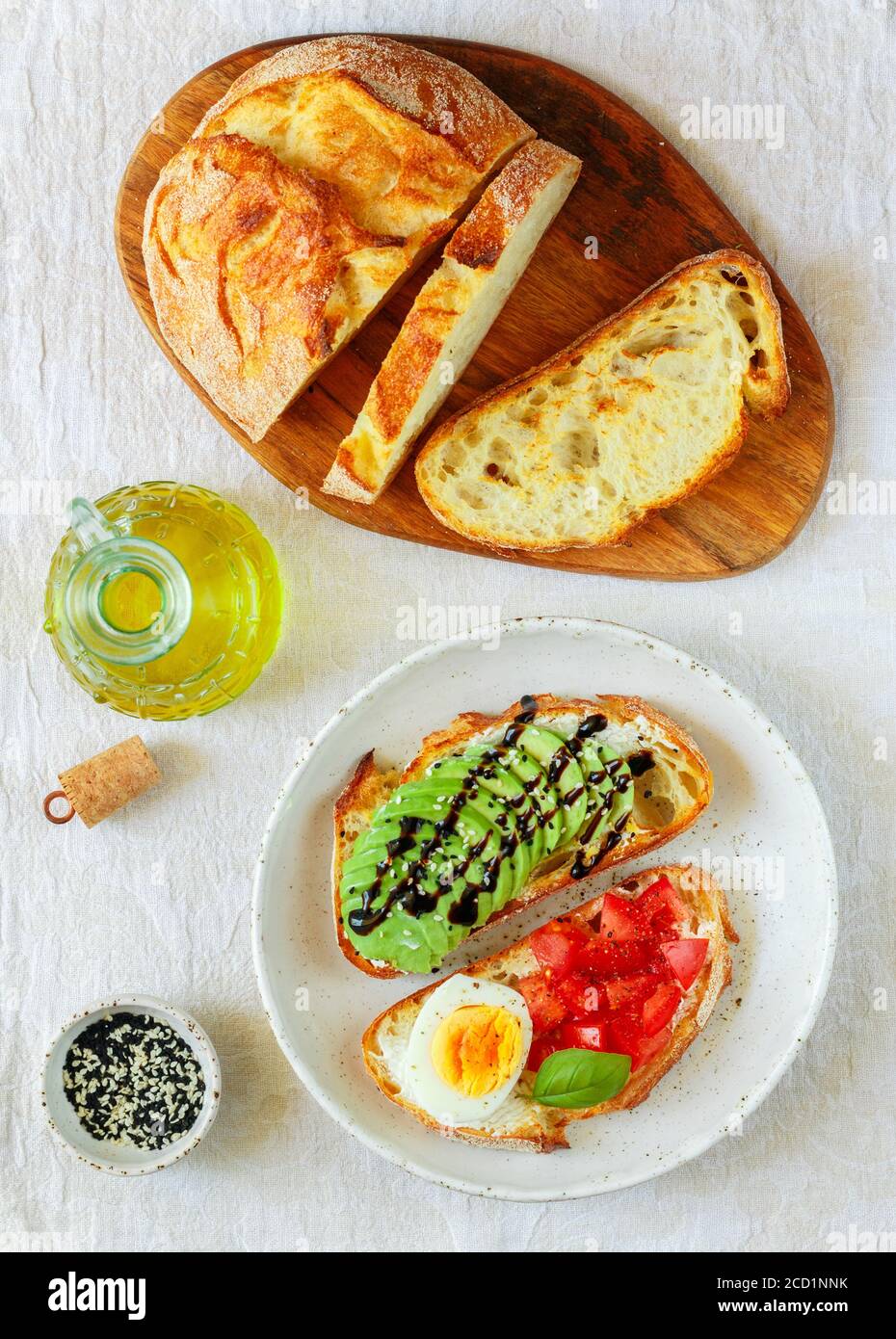 Wheat bread sandwiches with cream cheese (ricotta), avocado, eggs, tomato, Basil, black and