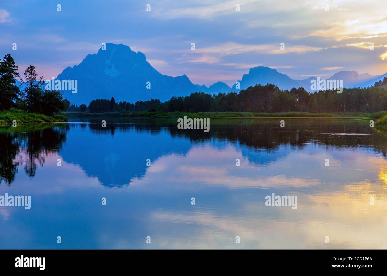 Oxbow Bend at Grand Teton National Park near Jackson, Wyoming with a view of Mount Moran reflecting in the Snake River at sunset Stock Photo