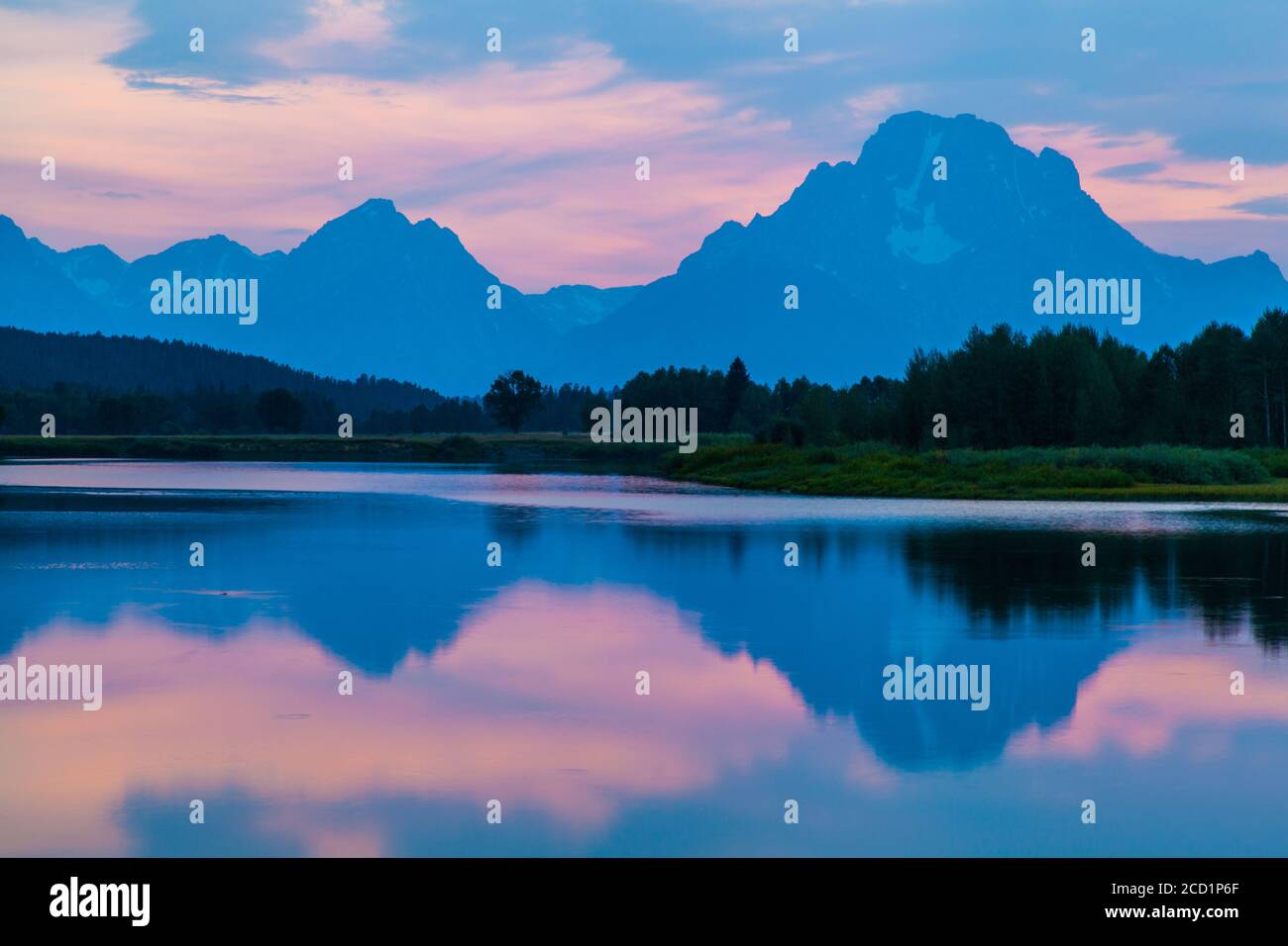 Oxbow Bend at Grand Teton National Park near Jackson, Wyoming with a view of Mount Moran reflecting in the Snake River at sunset Stock Photo