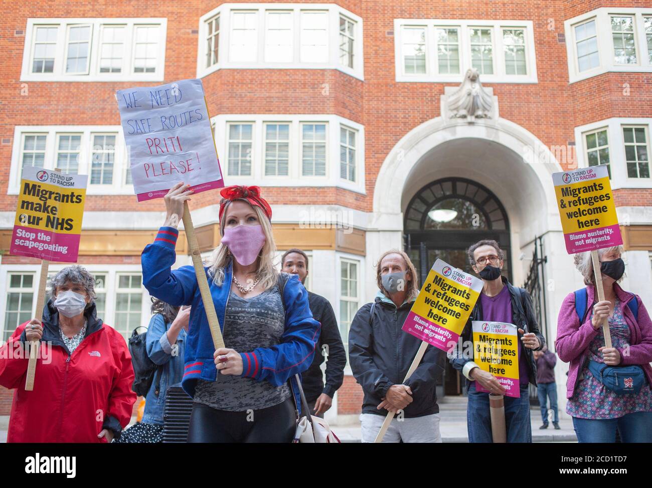 Protesters at a ‘Refugees Welcome Here’ protest outside the home office, organised by Stand up to Racism, South London and Care 4 Calais. London UK Stock Photo