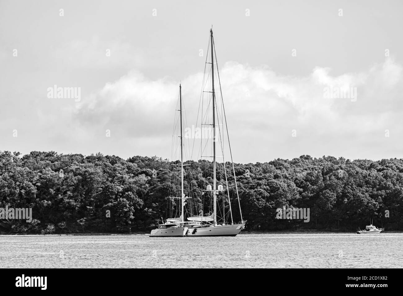 Black and white image of a two large sailboats in Smith Cove, Shelter Island, NY Stock Photo