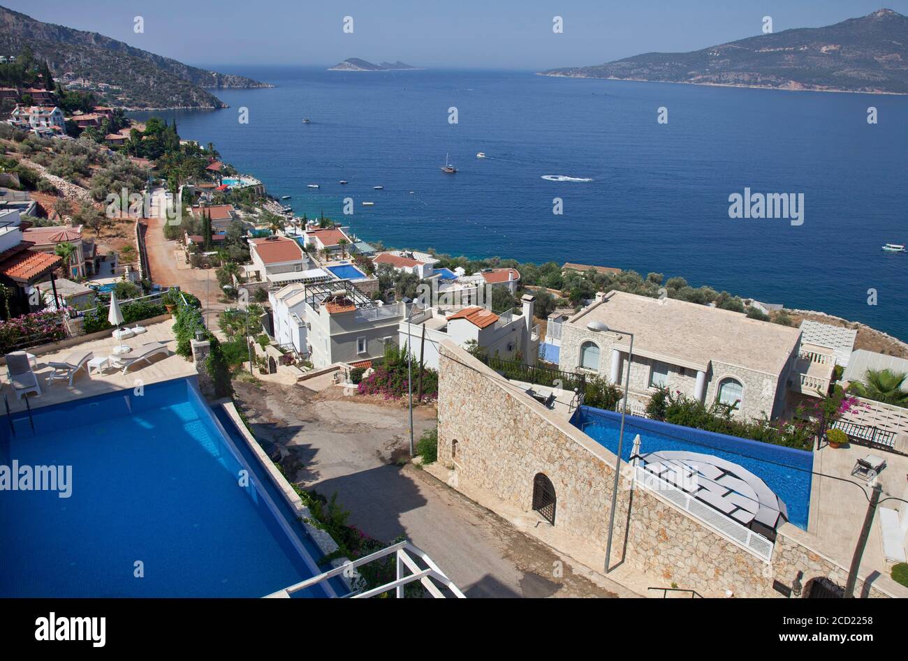 Villas in the area of Kormuluk  ( an area of Kalkan ) overlooking Kalkan bay in Turkey.  Kalkan is a popular holiday destination and is located on the Stock Photo