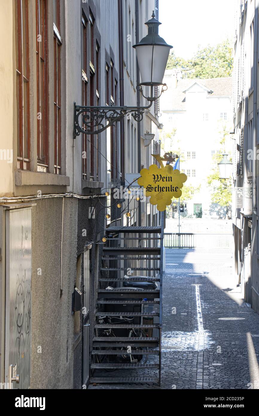 ZURICH, SWITZERLAND, JUL 30 2020, Historic street with hanging sign of