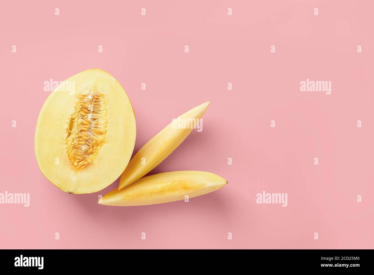 Half And Two Slices Of Yellow Ripe Honeydew Melon Over Pastel Pink Background Vegetarian Raw Food Diet And Healthy Eating Concept Copy Space Stock Photo Alamy