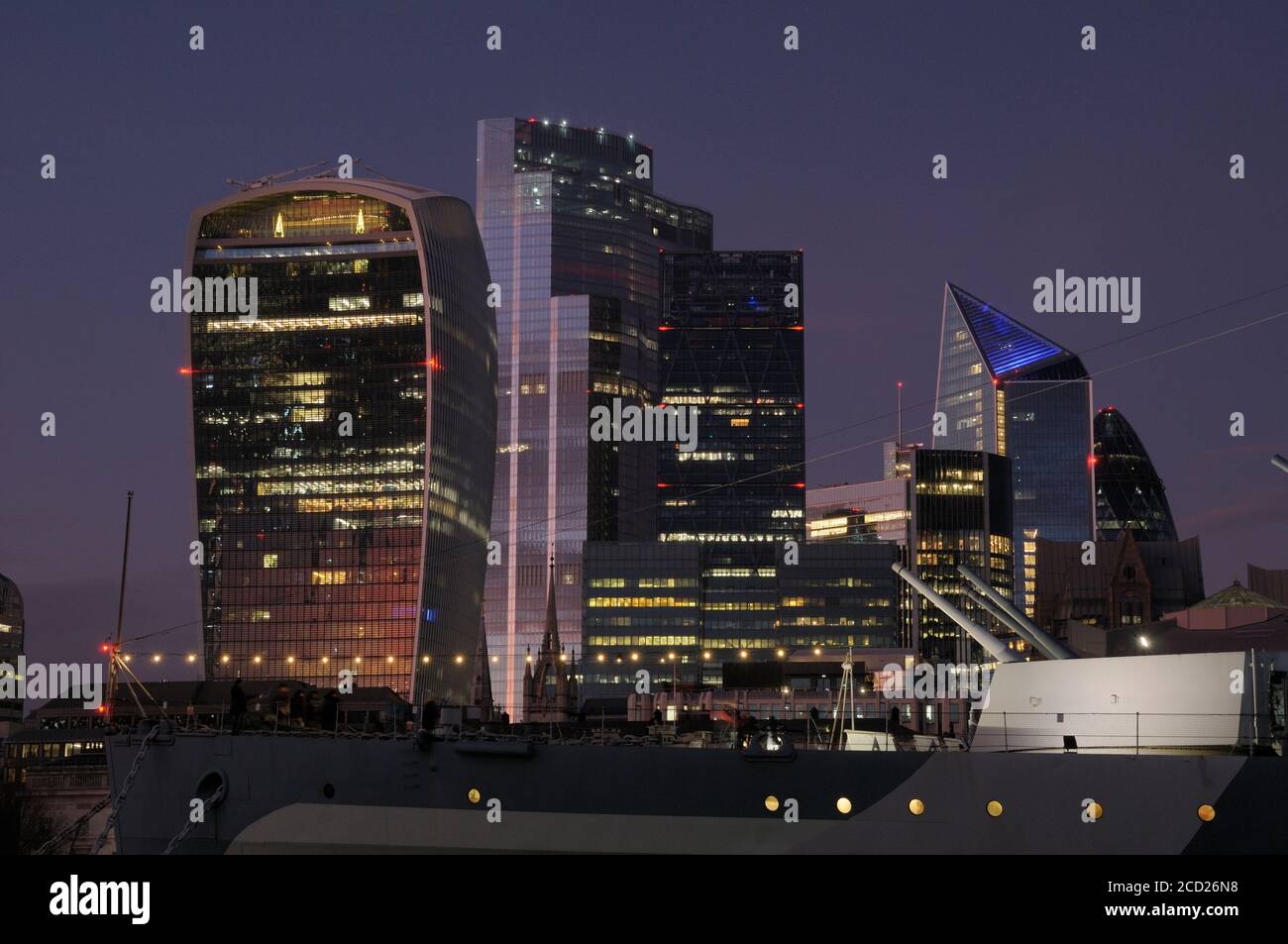 City of London skyline at dusk with HMS Belfast in the foreground, London, England, UK Stock Photo
