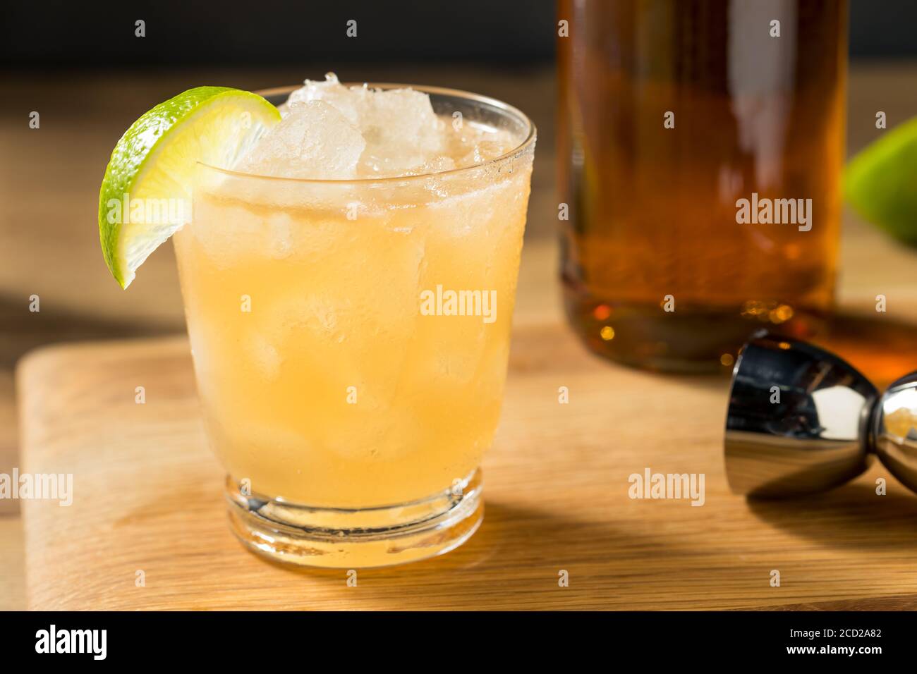Boozy Refreshing Rum Navy Grog Cocktail with Lime and Grapefruit Stock