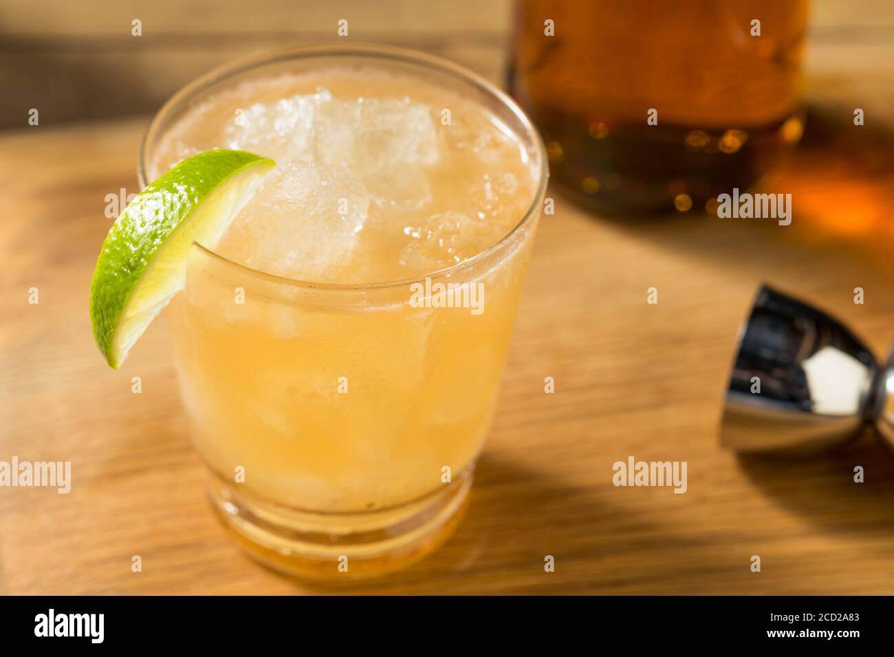 Boozy Refreshing Rum Navy Grog Cocktail with Lime and Grapefruit Stock
