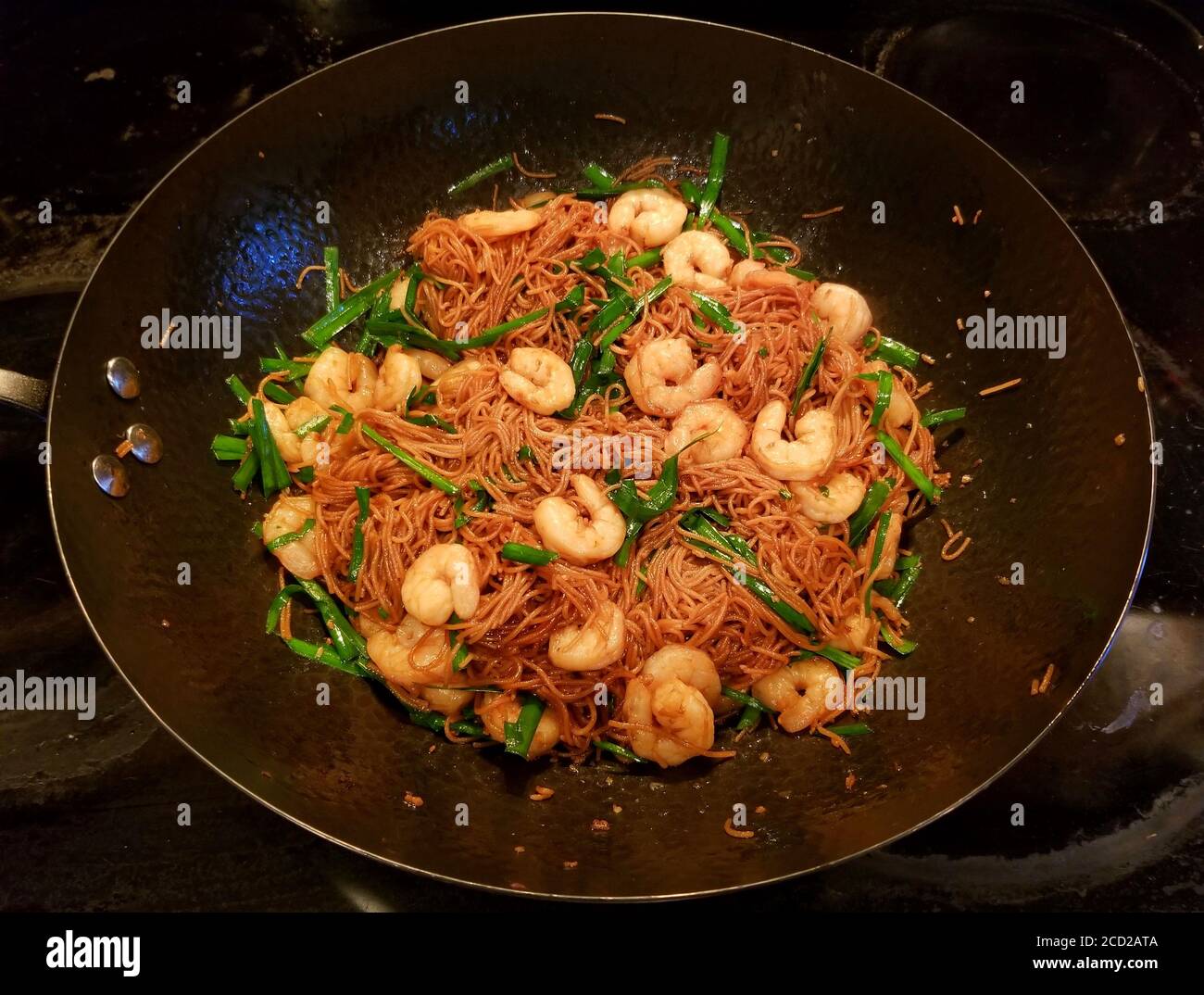 Fried rice noodle with shrimp and chives inside a wok Stock Photo Alamy