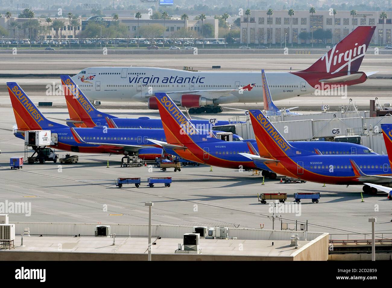 Las Vegas, Nevada, USA. 12th Jan, 2015. A Virgin Atlantic passenger aircraft - Boeing 747 - taxis by Southwest Airline aircrafts at McCarran International Airport on January 12, 2015, in Las Vegas, Nevada. Credit: David Becker/ZUMA Wire/Alamy Live News Stock Photo