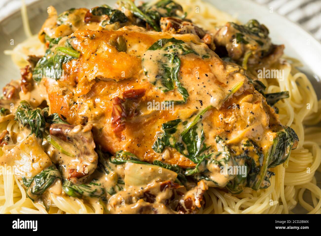 Homemade Creamy Italian Tuscan Chicken with Spinach and Pasta Stock