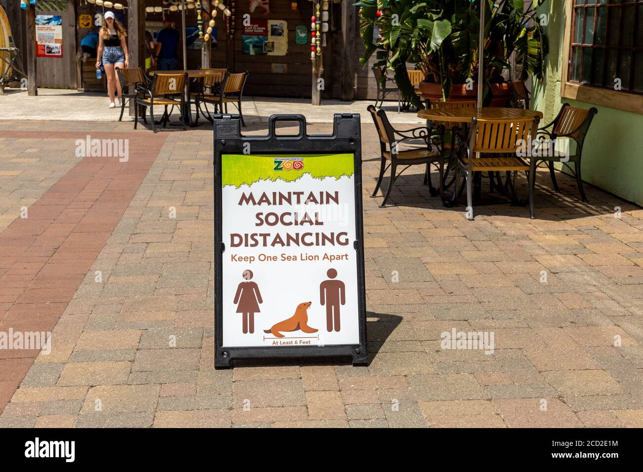 A social distancing reminder on a patio at the Fort Wayne Children's Zoo. Stock Photo