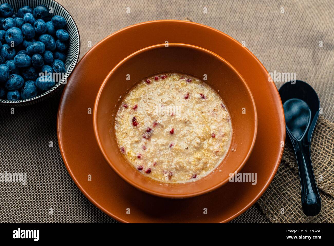 Healthy organic porridge topped with berries Stock Photo