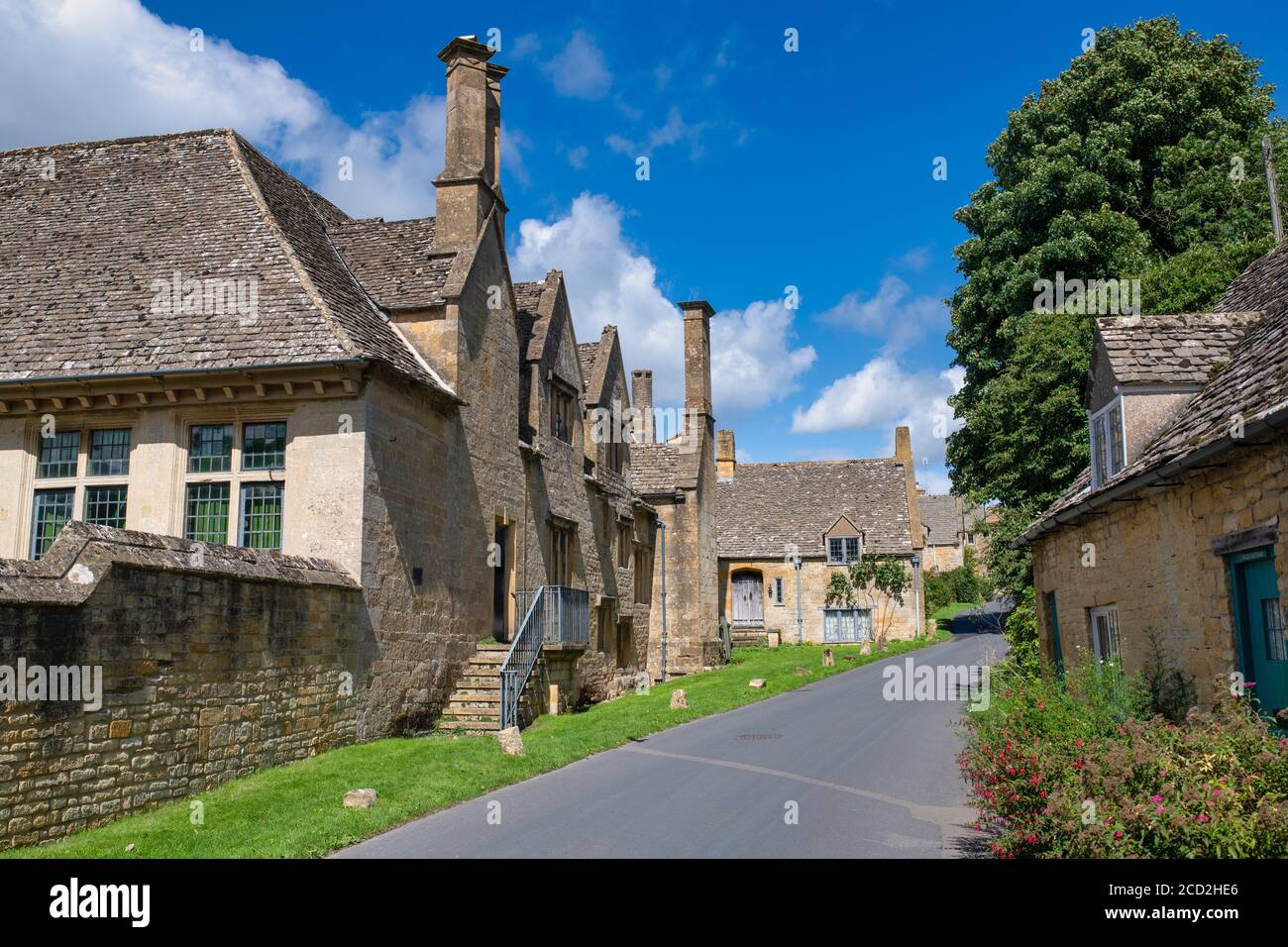 Snowshill manor along the main road in summer. Snowshill, Cotswolds, Gloucestershire, England Stock Photo