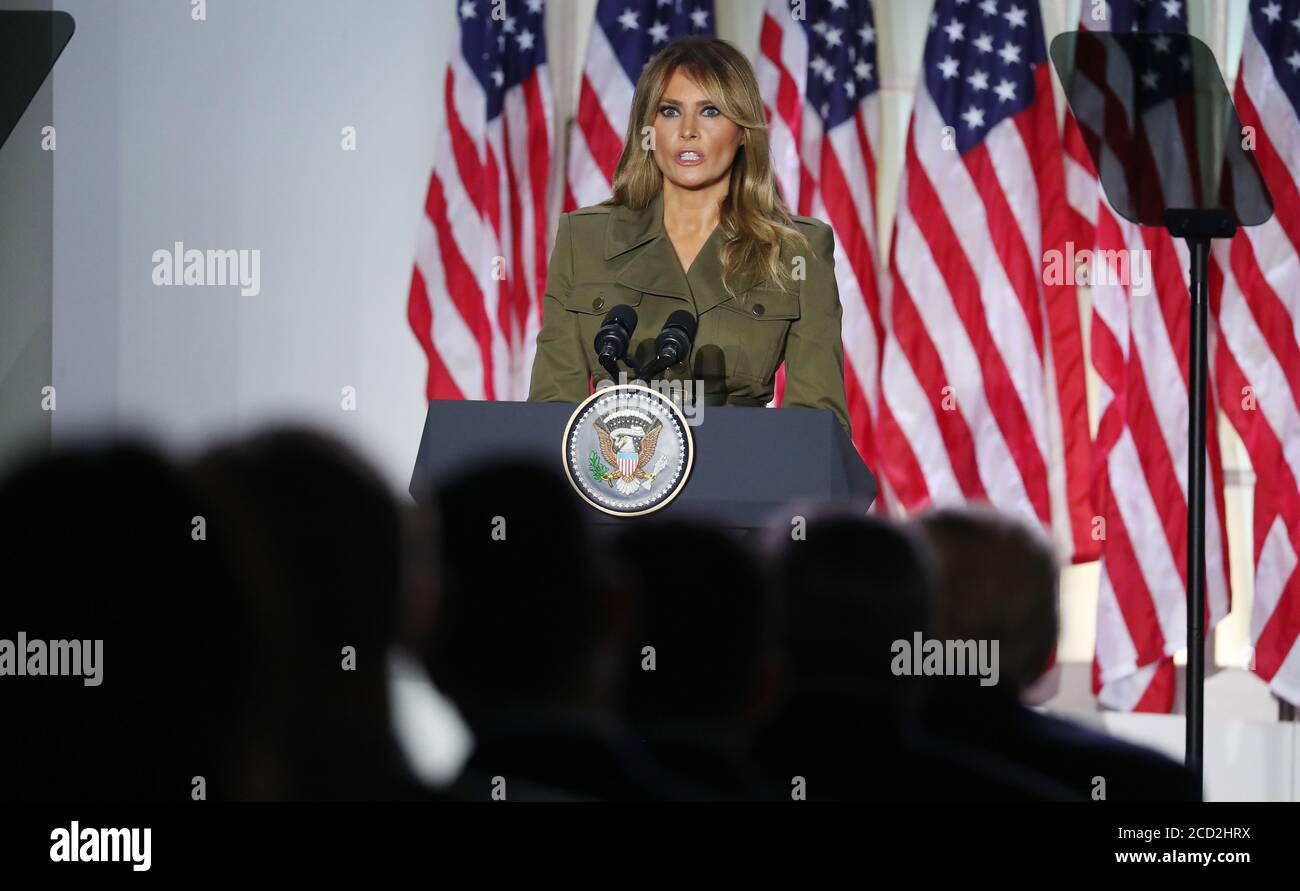 Washington, DC, USA. 25th Aug, 2020. US President Donald J. Trump (BR) listens as US First Lady Melania Trump delivers her speech during the second night of the Republican National Convention, in the Rose Garden at the White House in Washington, DC, USA, 25 August 2020. Due to the coronavirus pandemic the Republican Party has moved to a televised format for its convention.Credit: Michael Reynolds/Pool via CNP | usage worldwide Credit: dpa/Alamy Live News Stock Photo