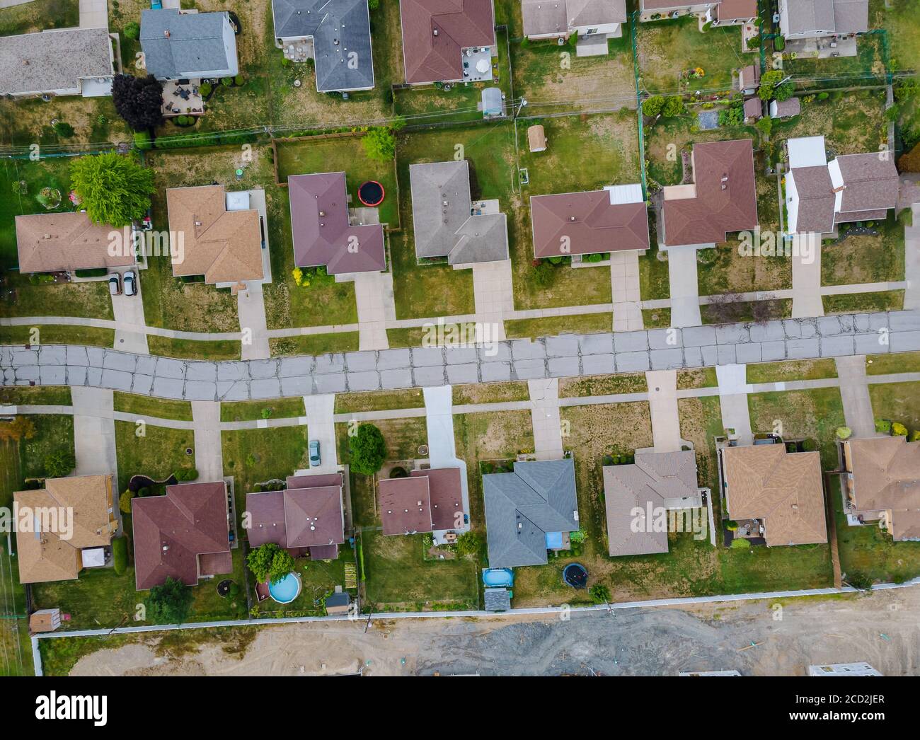 Aerial view of small town houses on road at landscape from above of the residential area Stock Photo
