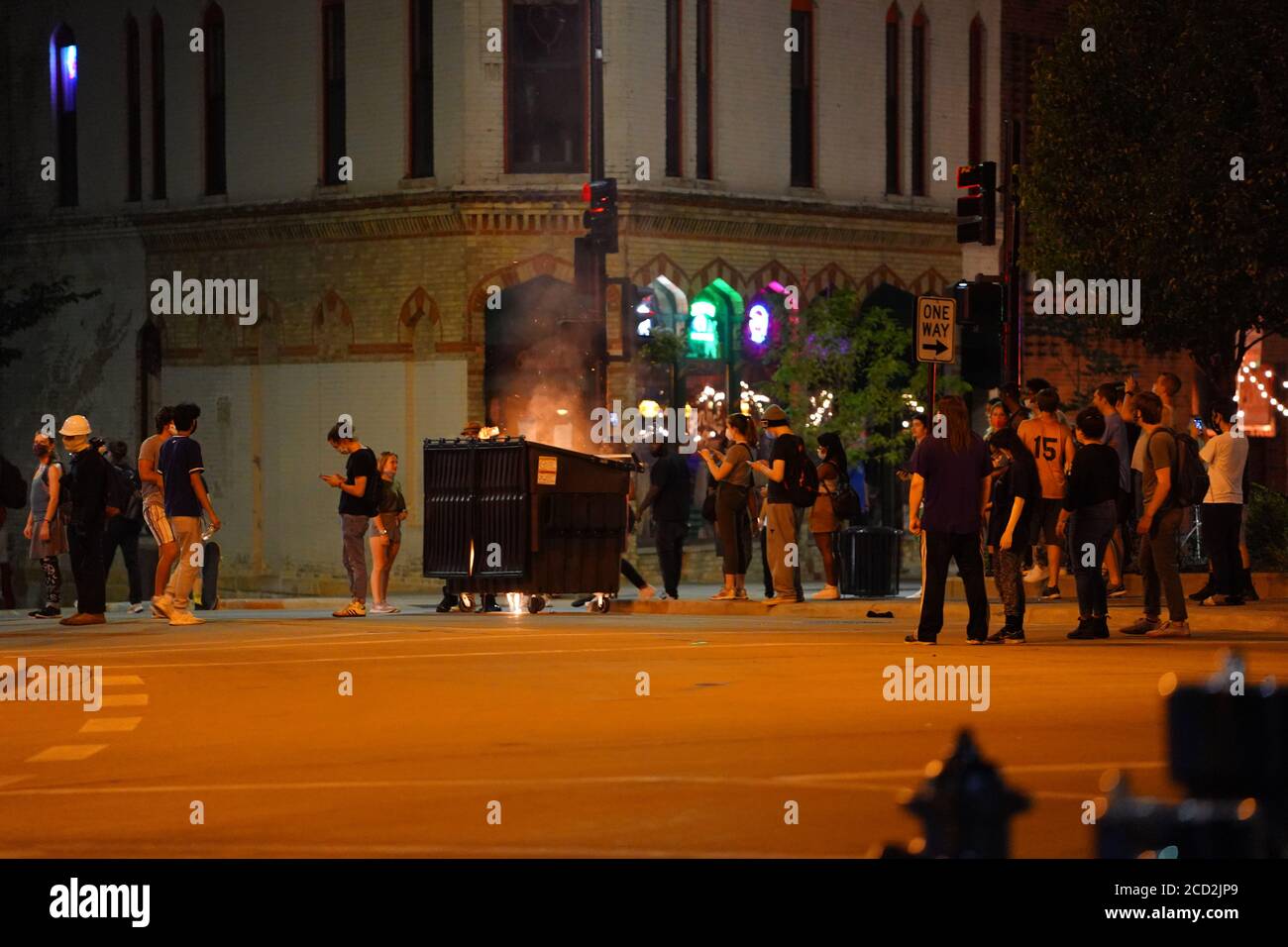 Rioters in the streets of wisconsin state capitol madison light fires ...