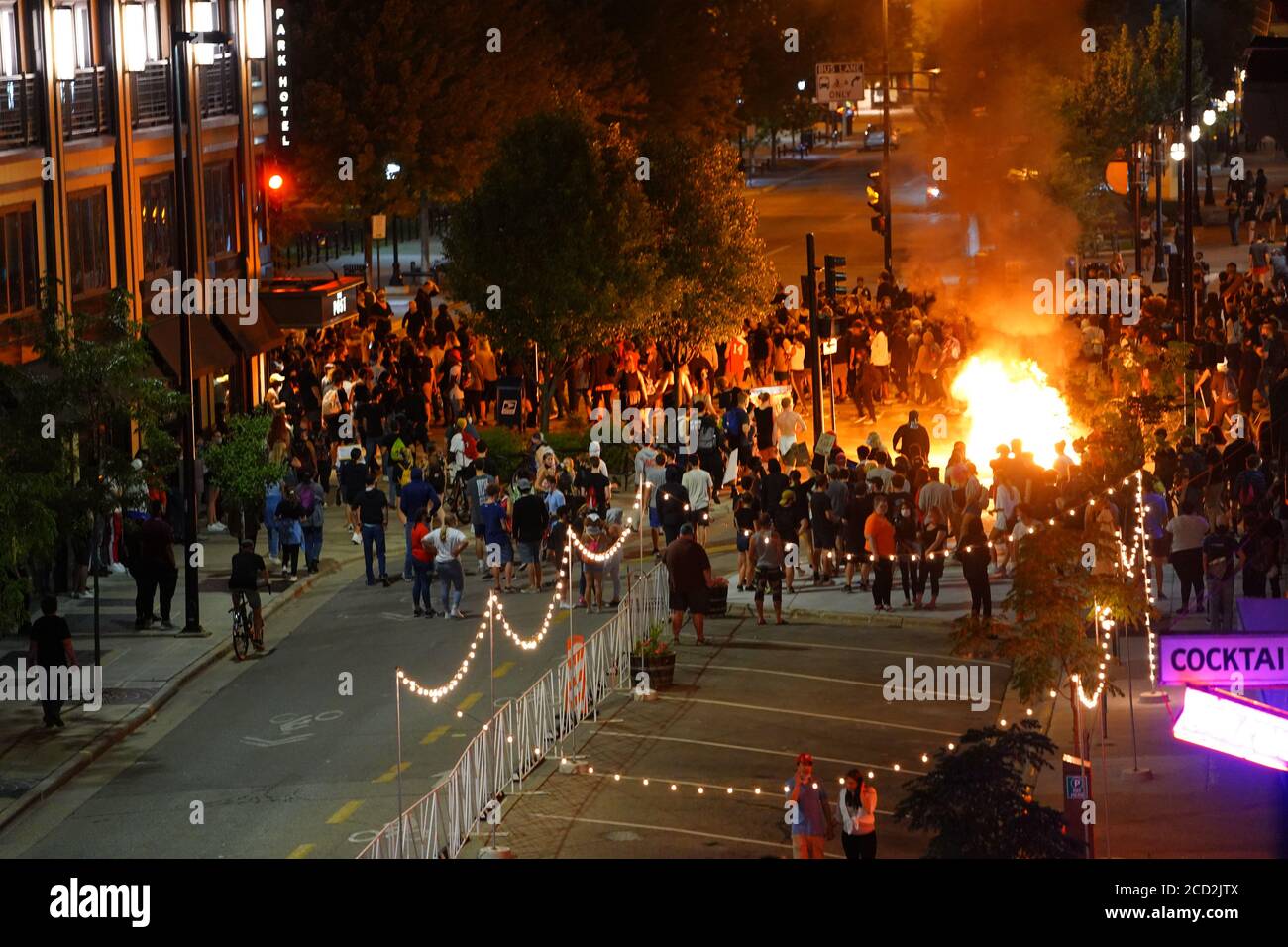 Rioters in the streets of wisconsin state capitol madison light fires ...