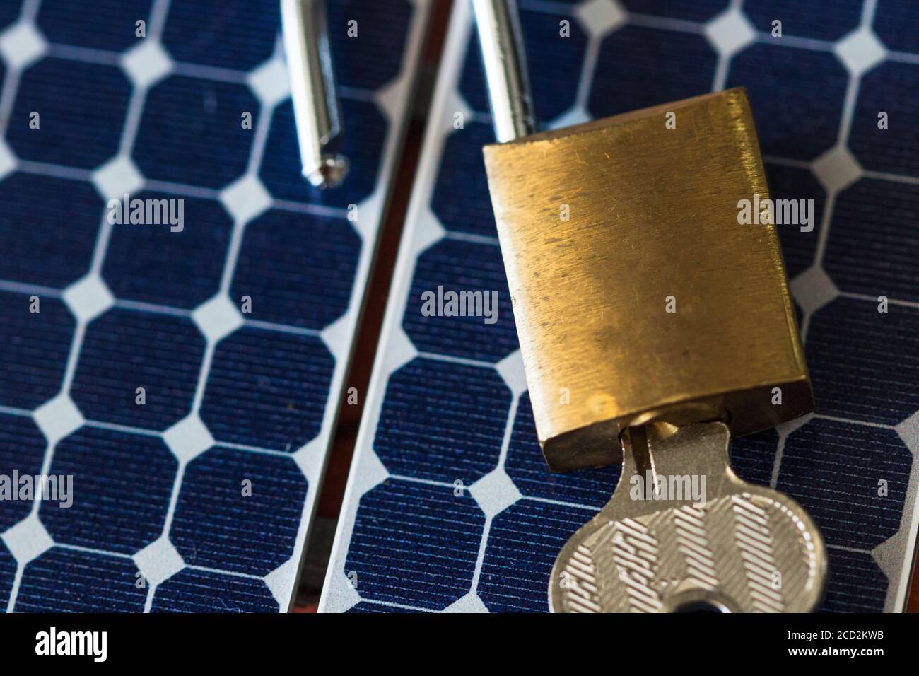 Padlock with key on photovoltaic solar panel on black background Stock ...