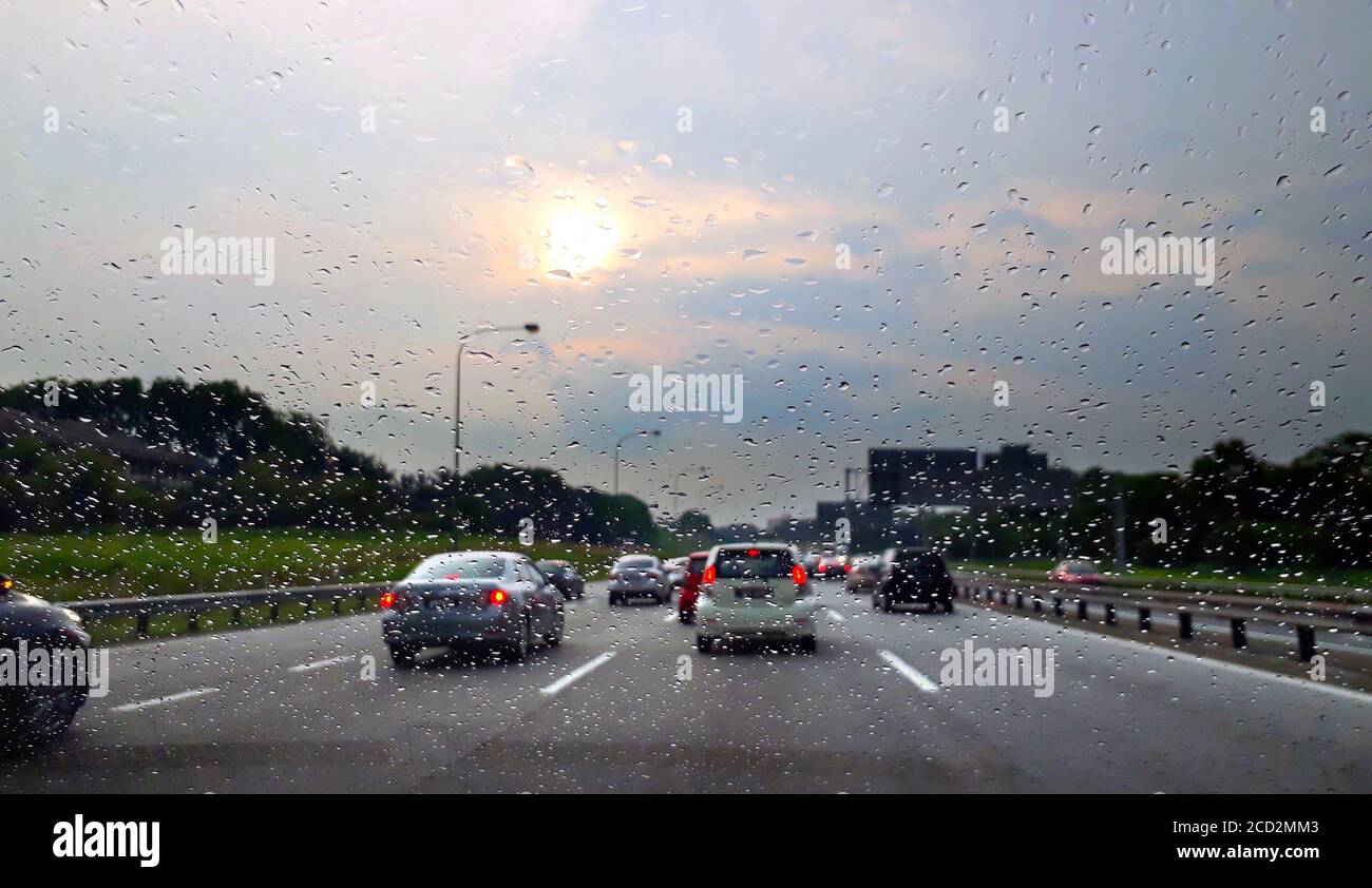 car windshield view during rainy day on highway in the evening Stock ...