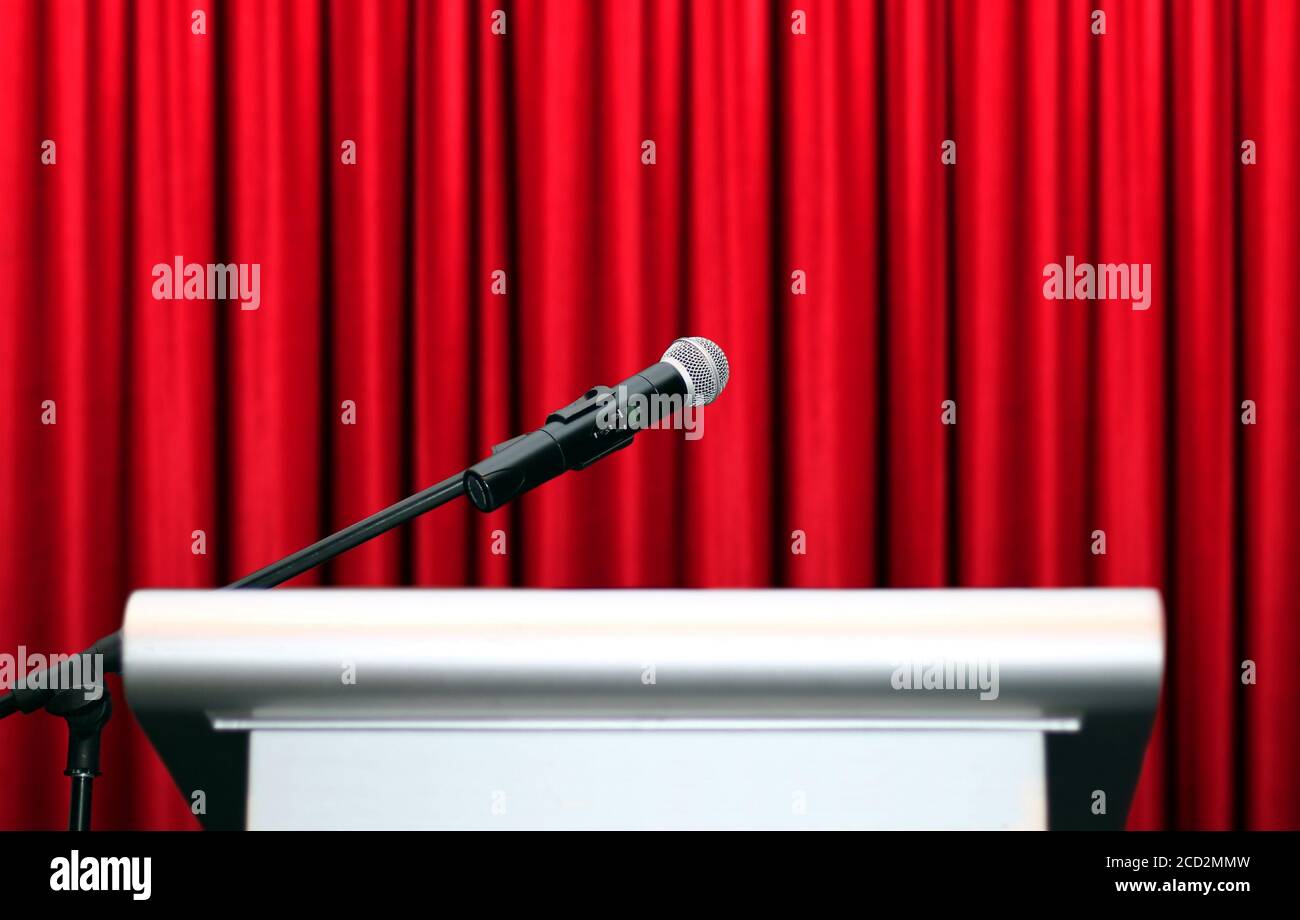Microphone On Stage With Red Curtain Background Stock Photo Alamy