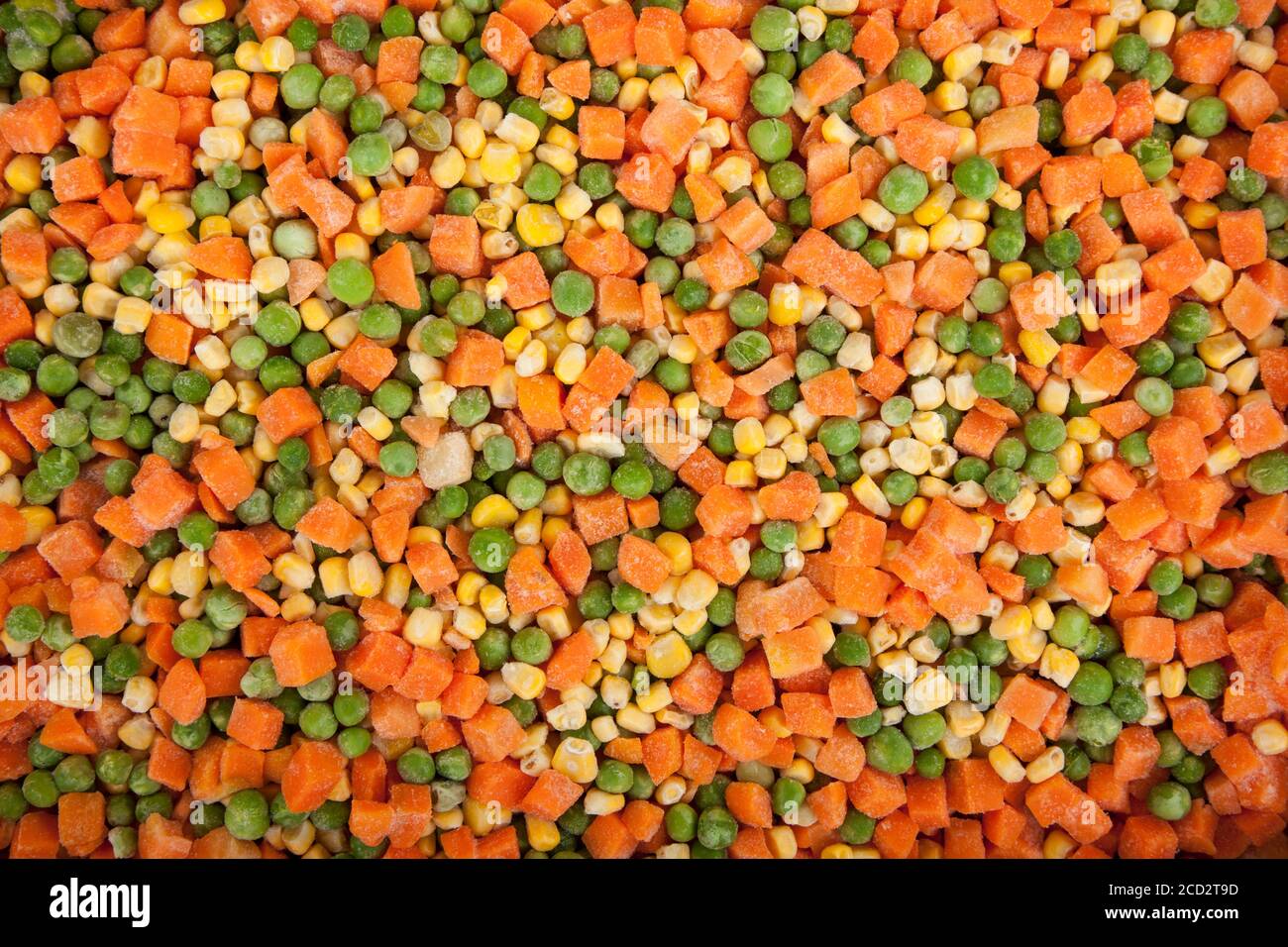 Frozen diced vegetables background with carrot, corn and peas Stock Photo Alamy