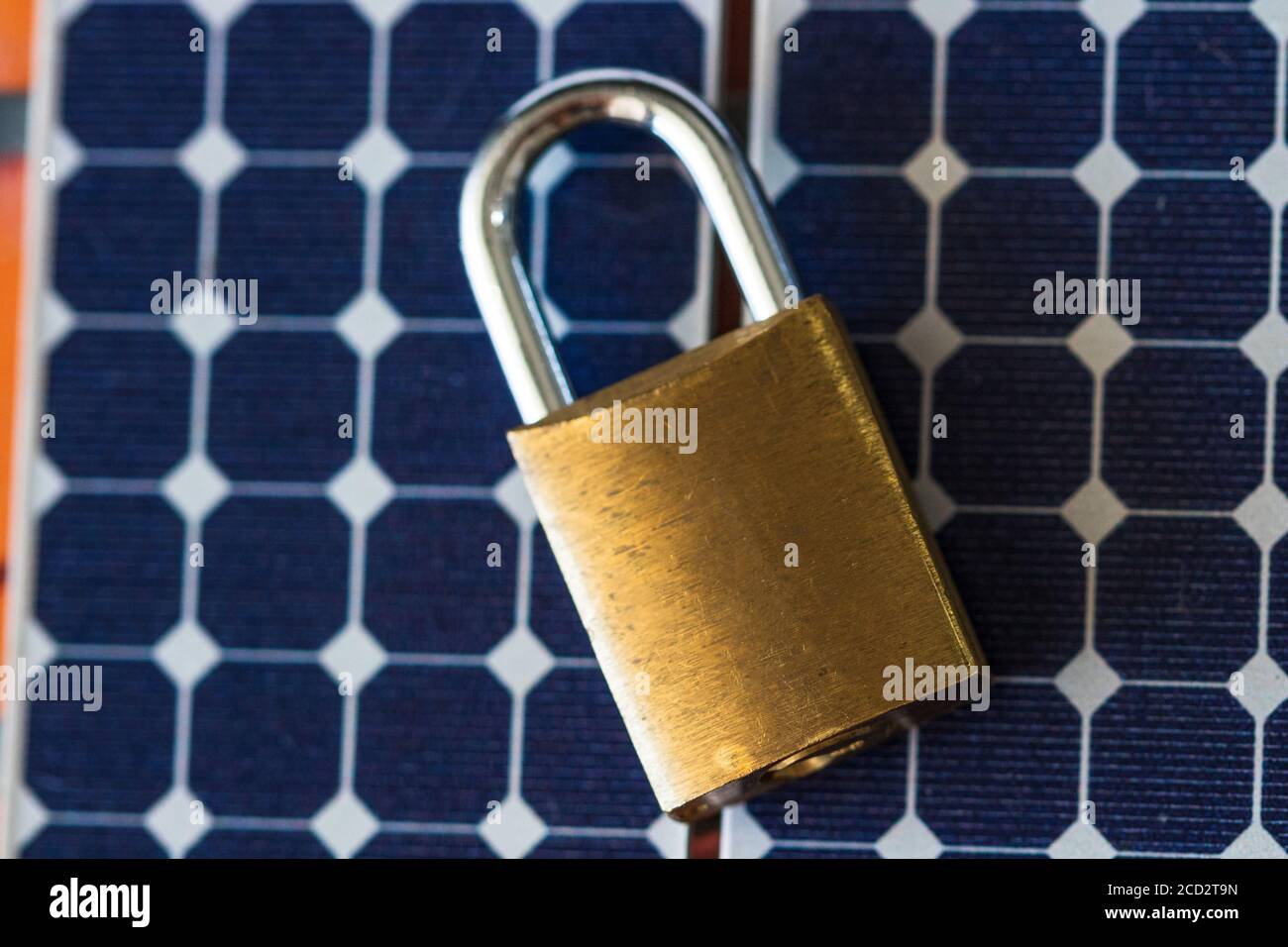 Padlock with key on photovoltaic solar panel on black background Stock ...