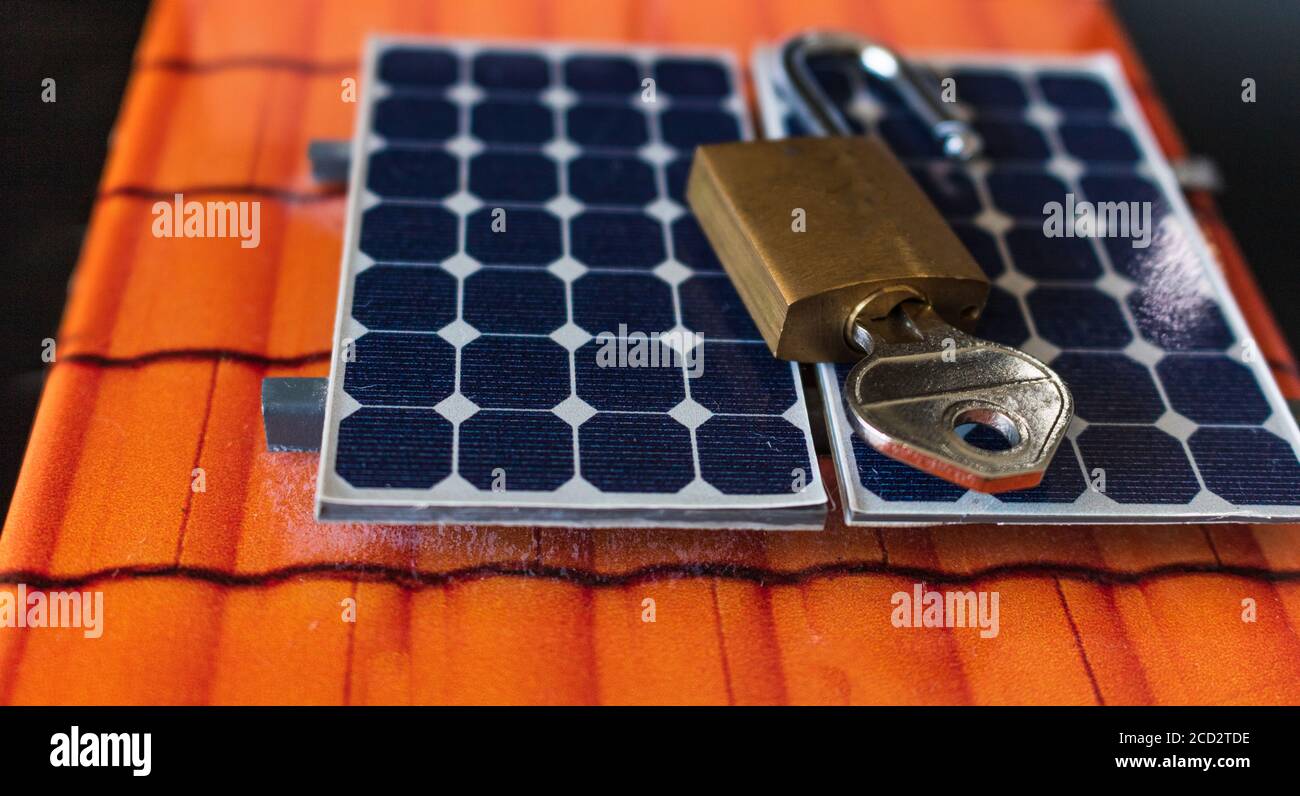 Padlock with key on photovoltaic solar panel on black background Stock ...