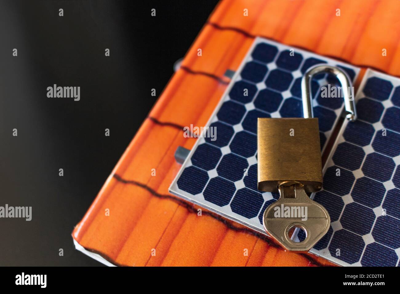 Padlock with key on photovoltaic solar panel on black background Stock ...