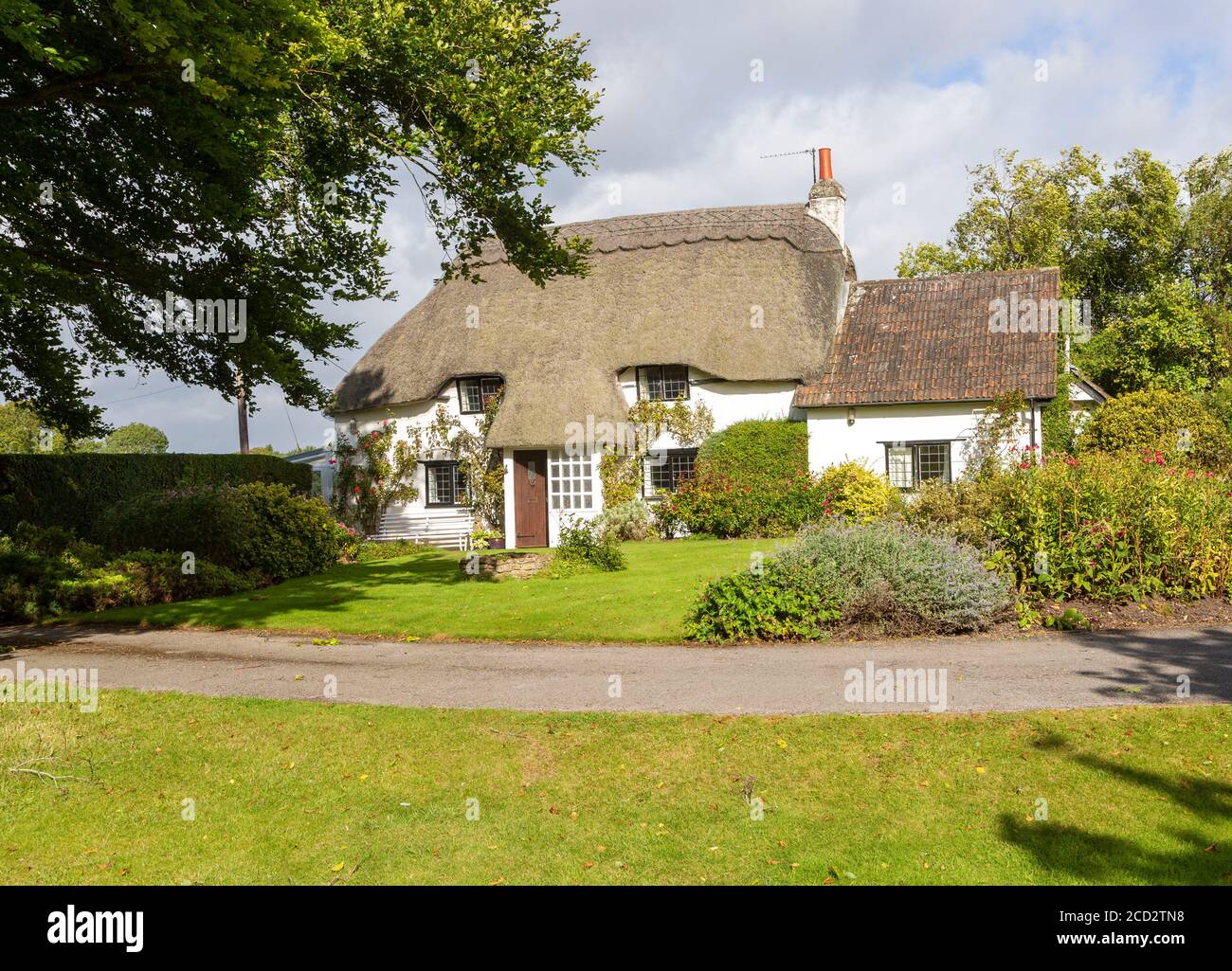 Pretty thatched country cottage and garden, Cherhill, Wiltshire, England, UK - property released Stock Photo