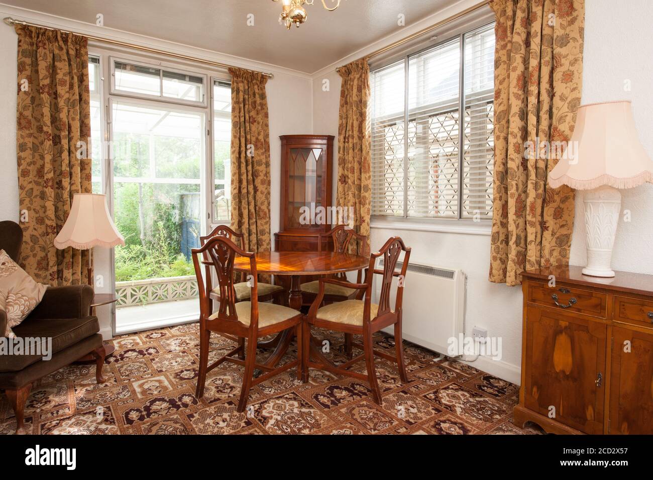 Dining table in old fashioned room Stock Photo - Alamy