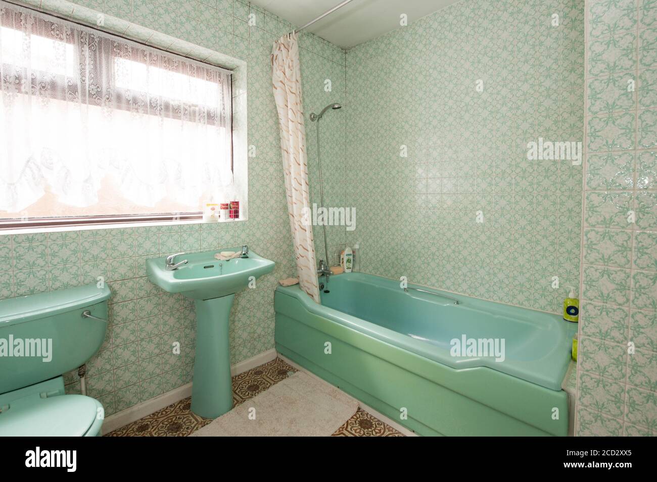 Old bathroom with outdated decor Stock Photo Alamy