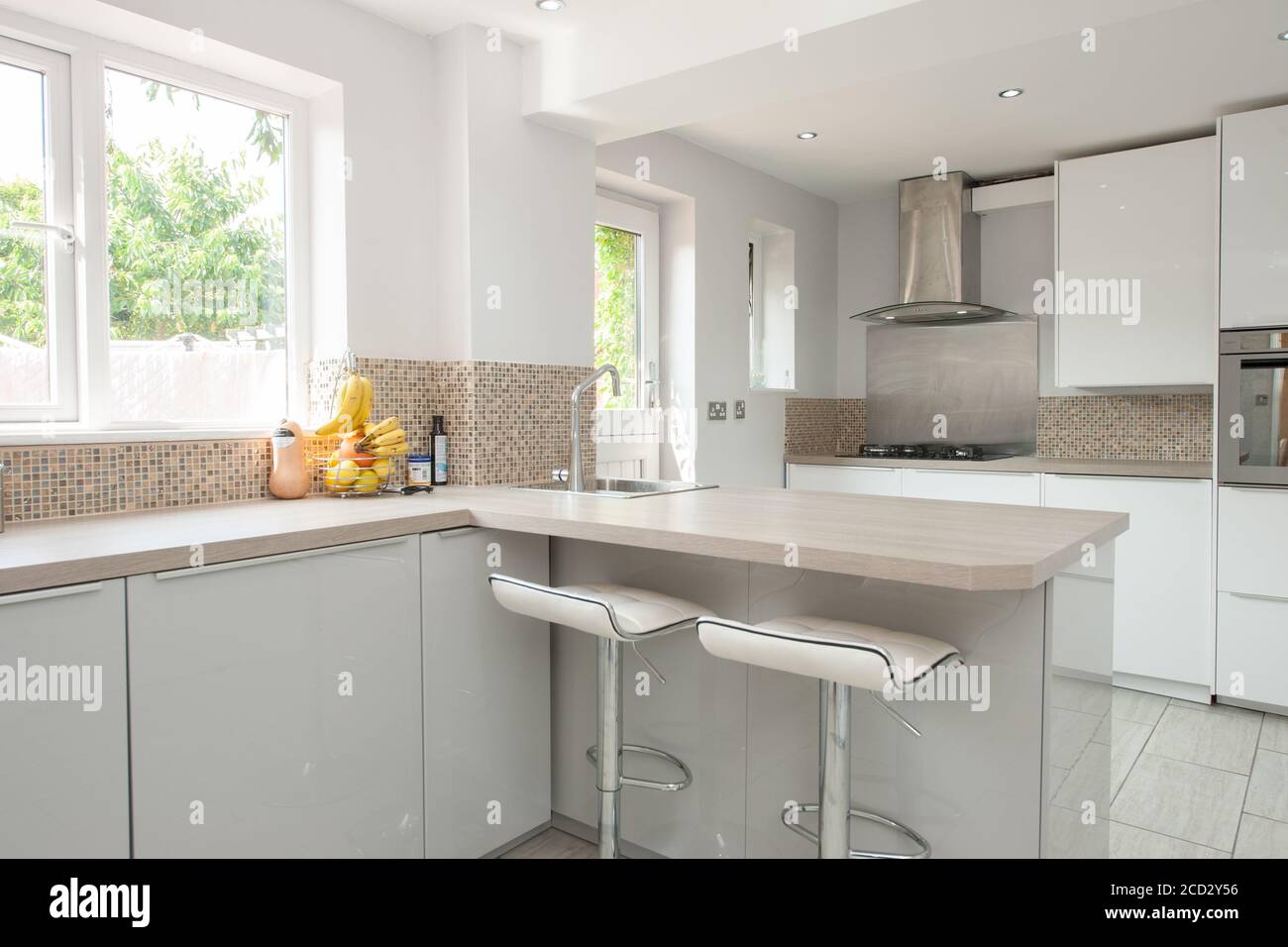 Modern kitchen with breakfast bar Stock Photo - Alamy