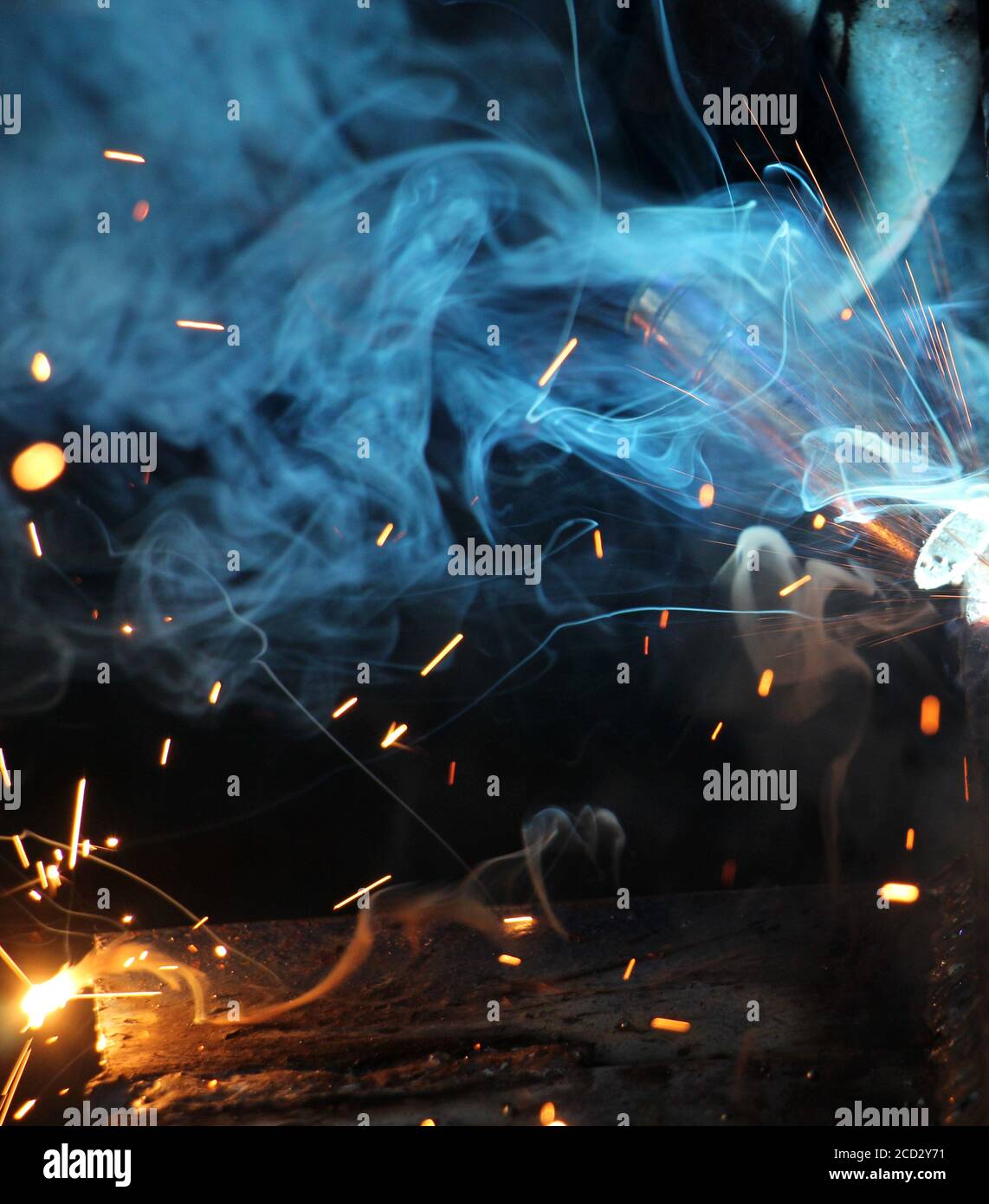 Welding work.sparks and smoke of a welding work,image of a Stock Photo