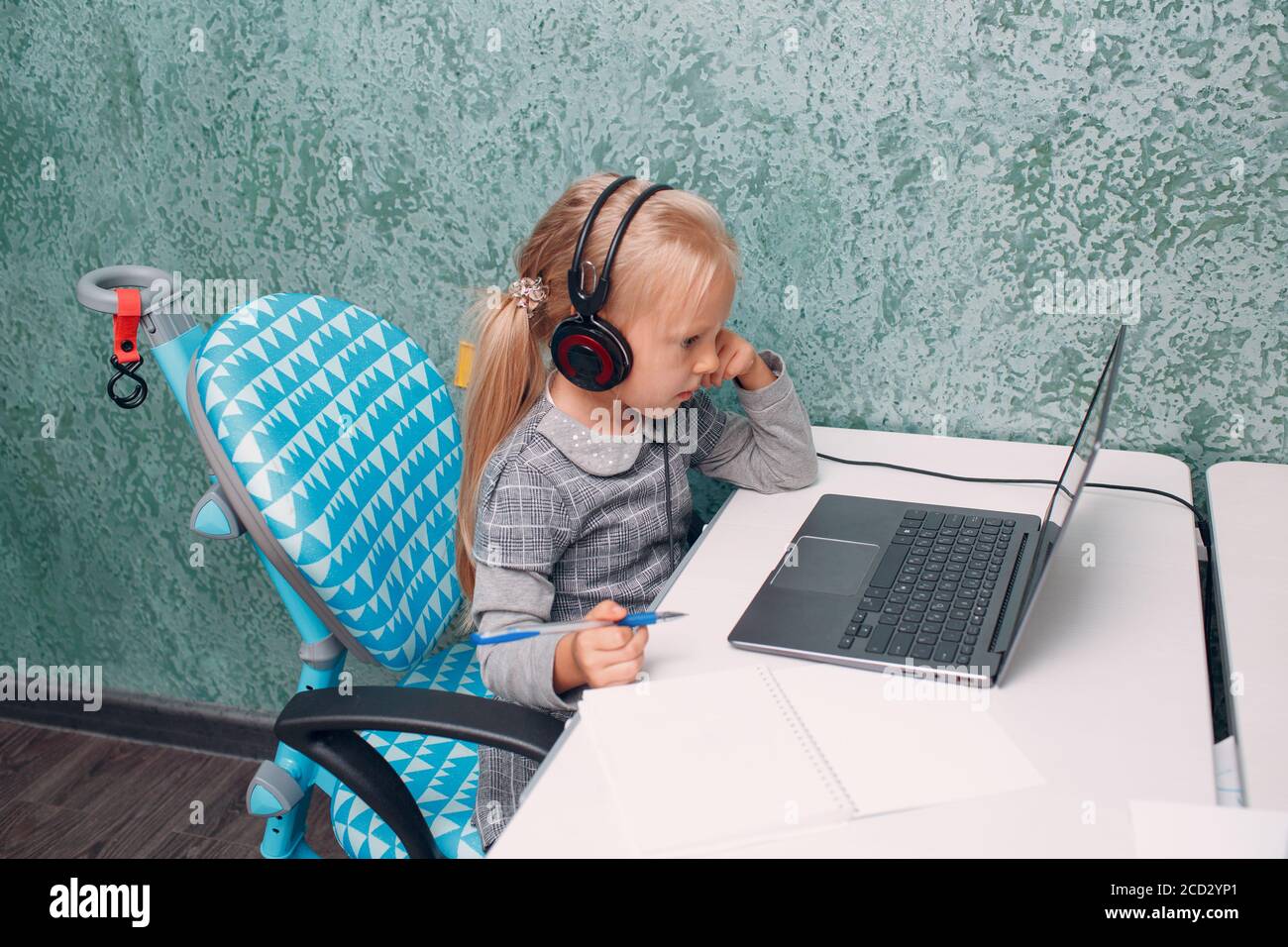 Little girl with laptop learning and preparing back to school Stock ...