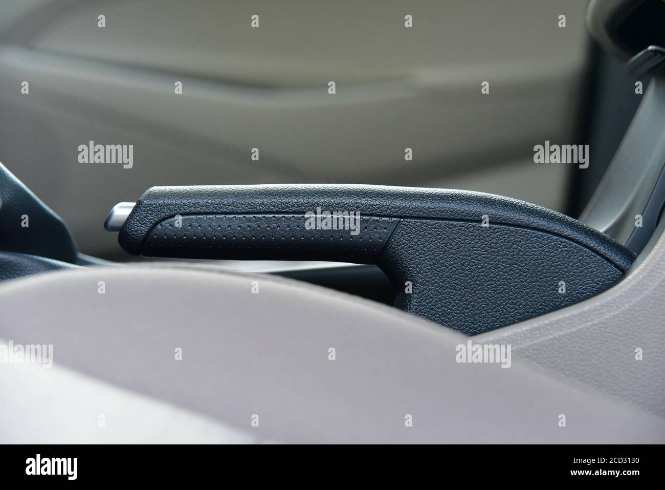 Manual brake in interior of modern car. Car parking brake Stock Photo