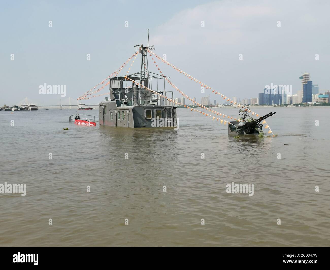 A patrol boat is flooded by rising water level caused by rainstorm in Wuhan city, south China's Hubei province, 30 June 2020. Stock Photo